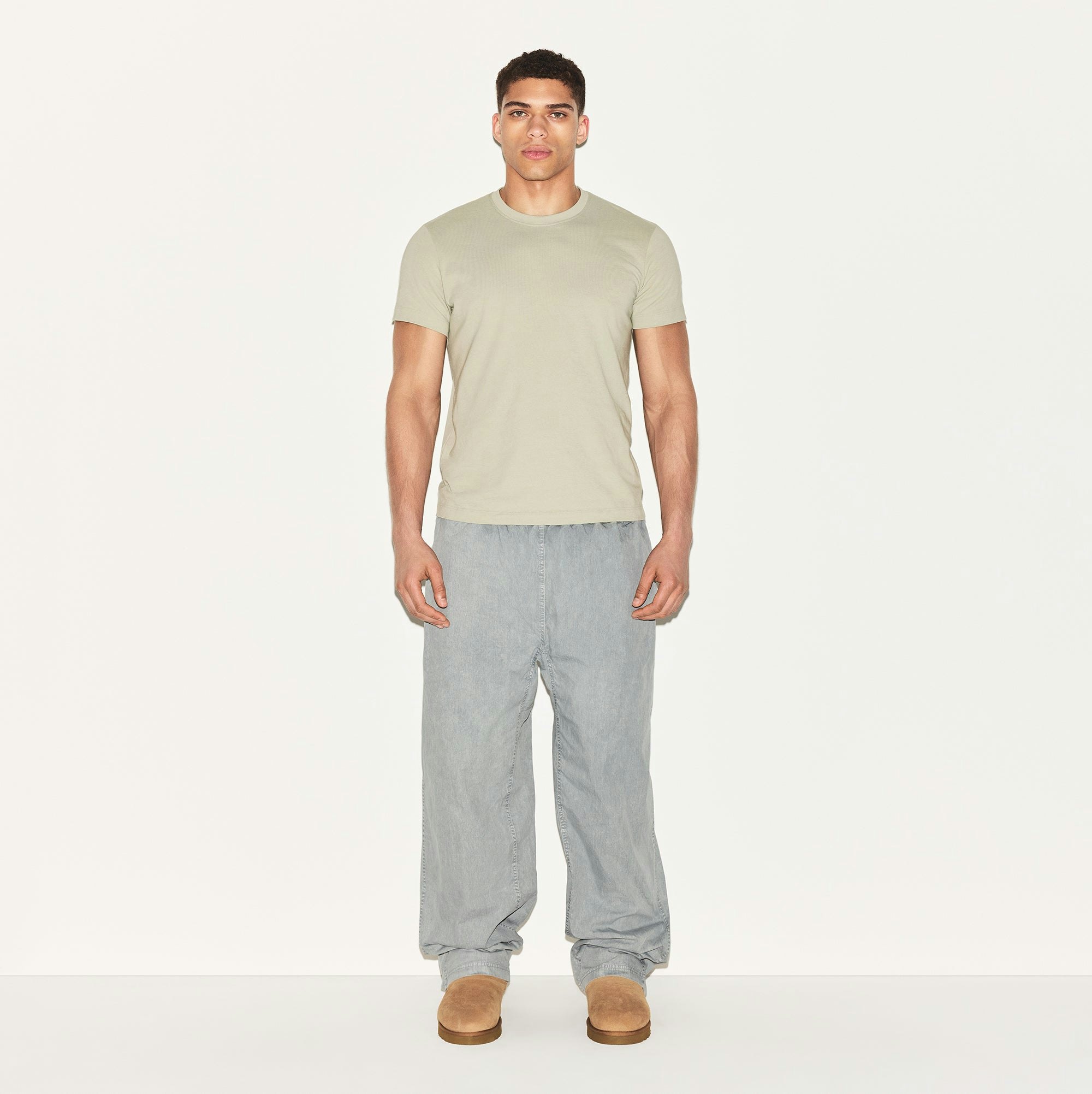 SKIMS COTTON MENS CLASSIC T-SHIRT | TALC ON A MODEL FRONT VIEW | FOCUS: 0.0, 1.0, 0.9