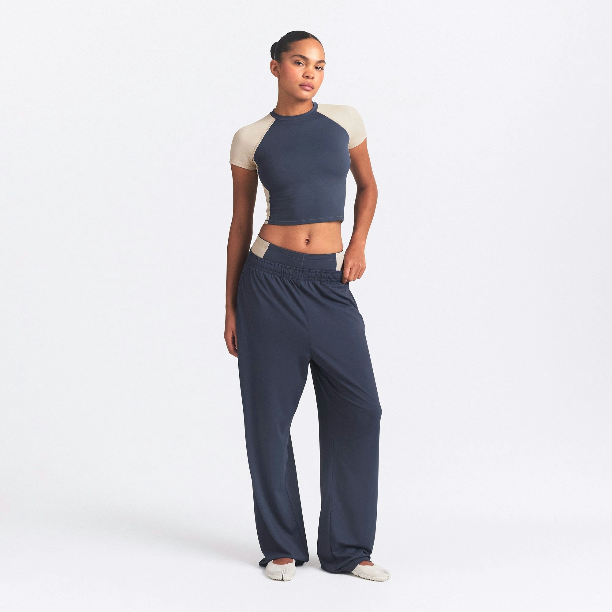 NikeSKIMS MATTE AND SHINE CREWNECK CROP SHORT SLEEVE | DEEP ROYAL/STONE ON A MODEL FRONT VIEW @ | FOCUS: 0.0, 1.0, 0.9