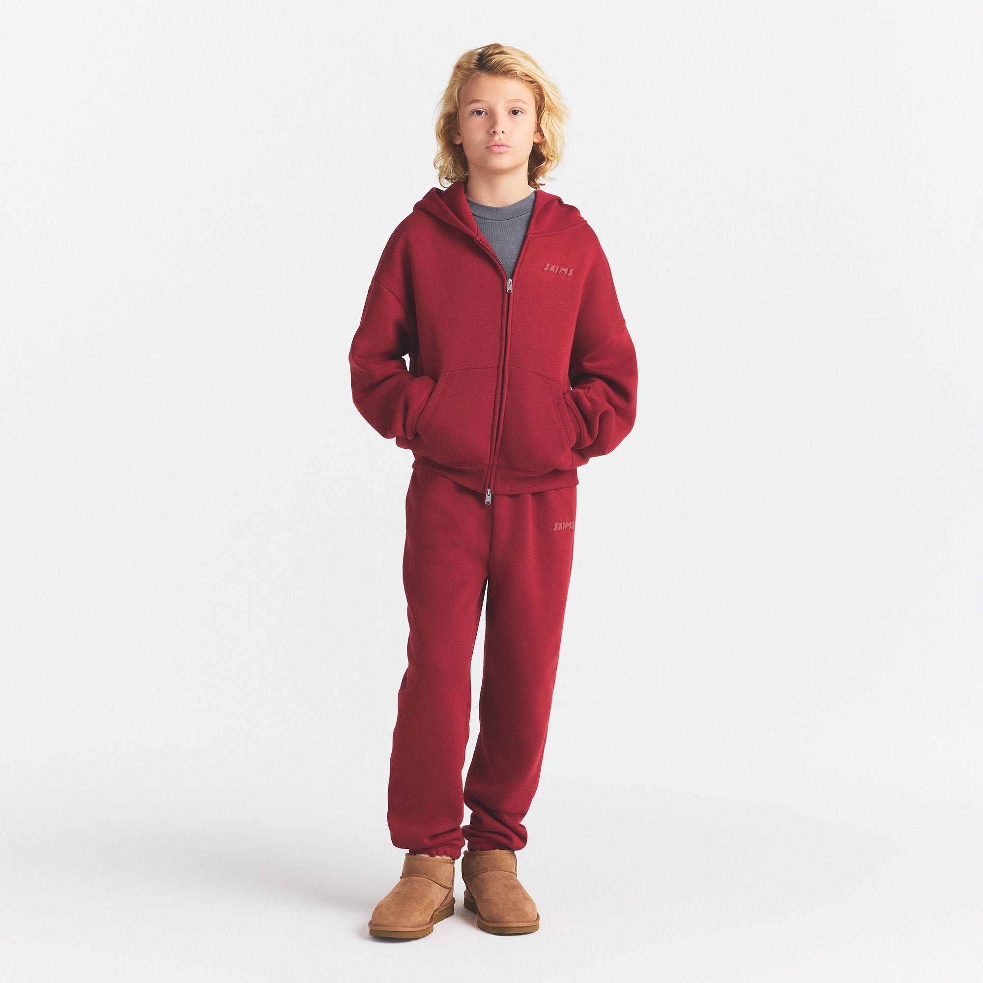 KIDS FLEECE ZIP UP HOODIE | BRICK ON A MODEL FRONT VIEW @ | FOCUS: 0.0, 1.0, 0.9