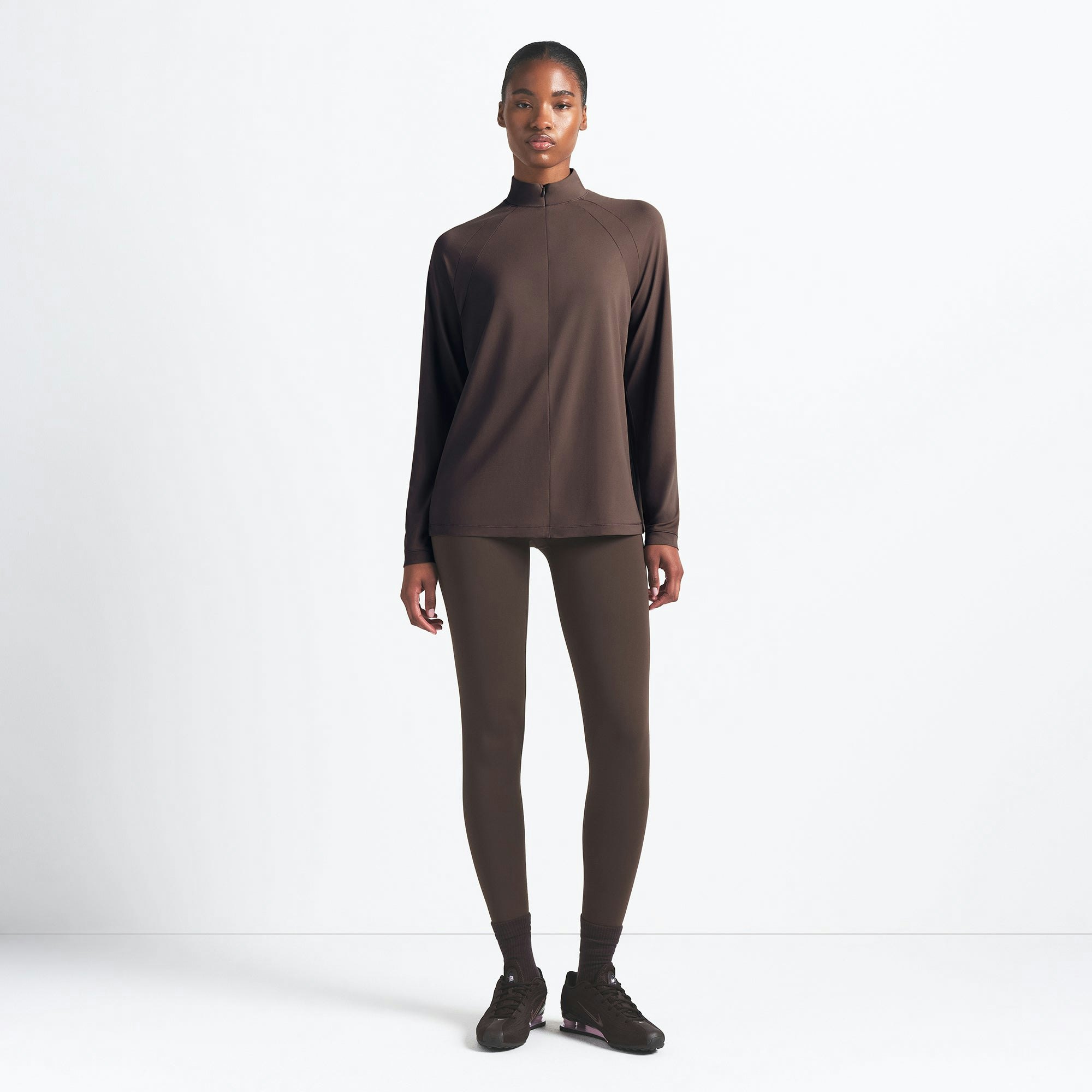 NikeSKIMS AIRY LONG SLEEVE HALF ZIP | DARK SEPIA ON A MODEL FRONT VIEW @ | FOCUS: 0.0, 1.0, 0.9