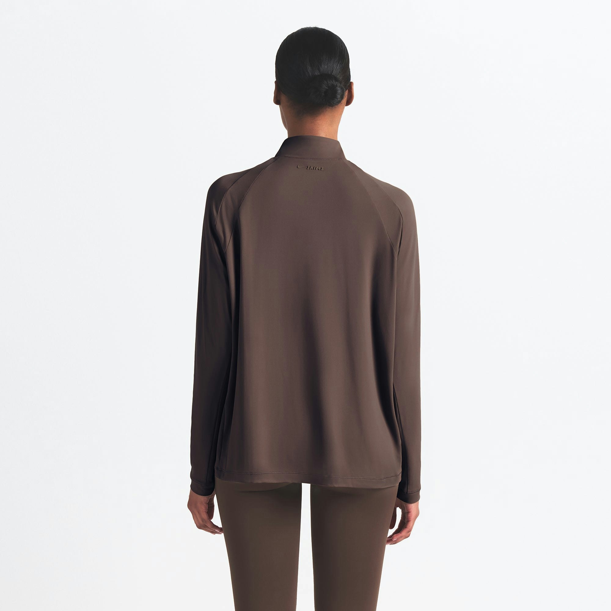 NikeSKIMS AIRY LONG SLEEVE HALF ZIP | DARK SEPIA ON A MODEL SIDE VIEW @ | FOCUS: 0.0, 1.0, 0.9