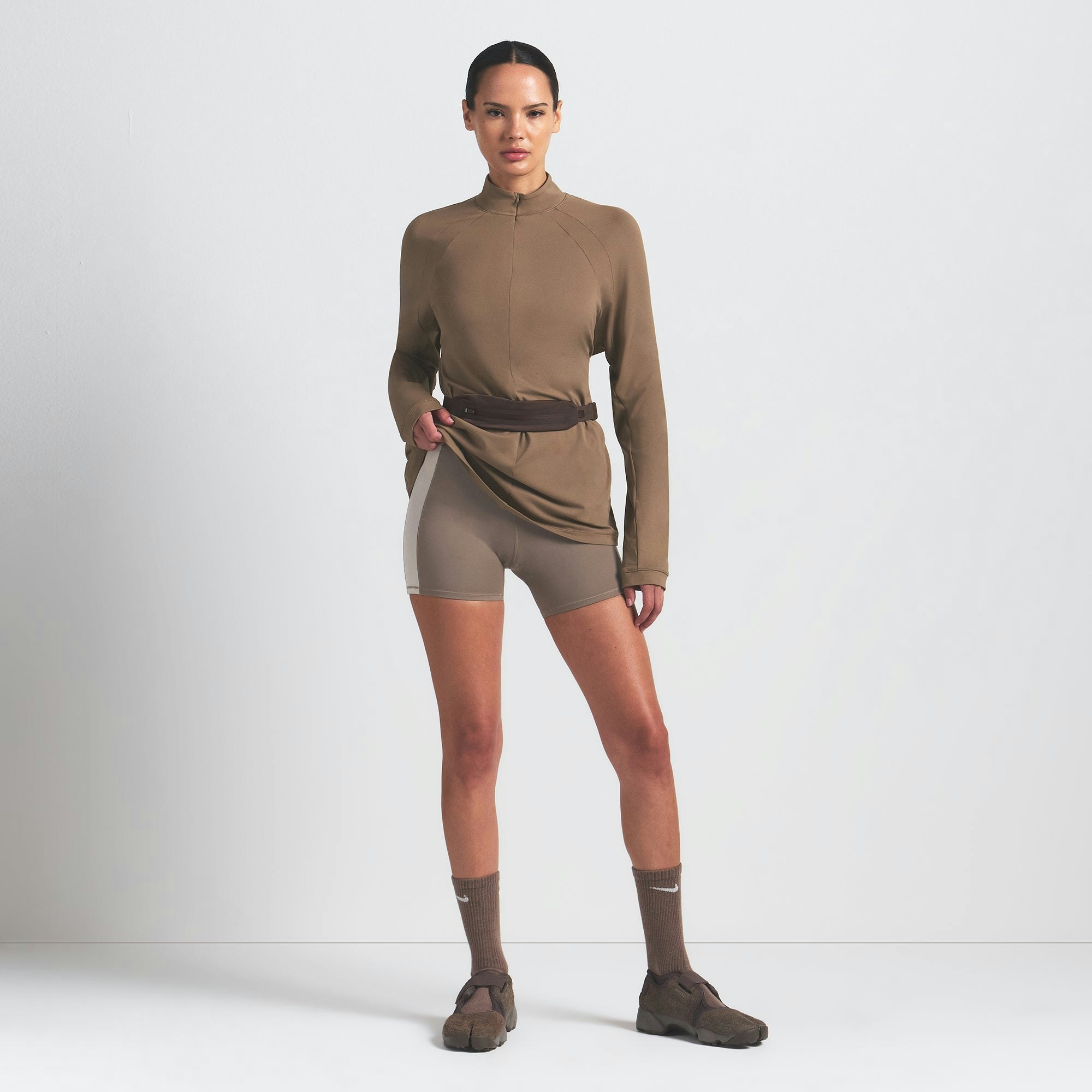 NikeSKIMS AIRY LONG SLEEVE HALF ZIP | MYRRH ON A MODEL FRONT VIEW @ | FOCUS: 0.0, 1.0, 0.9