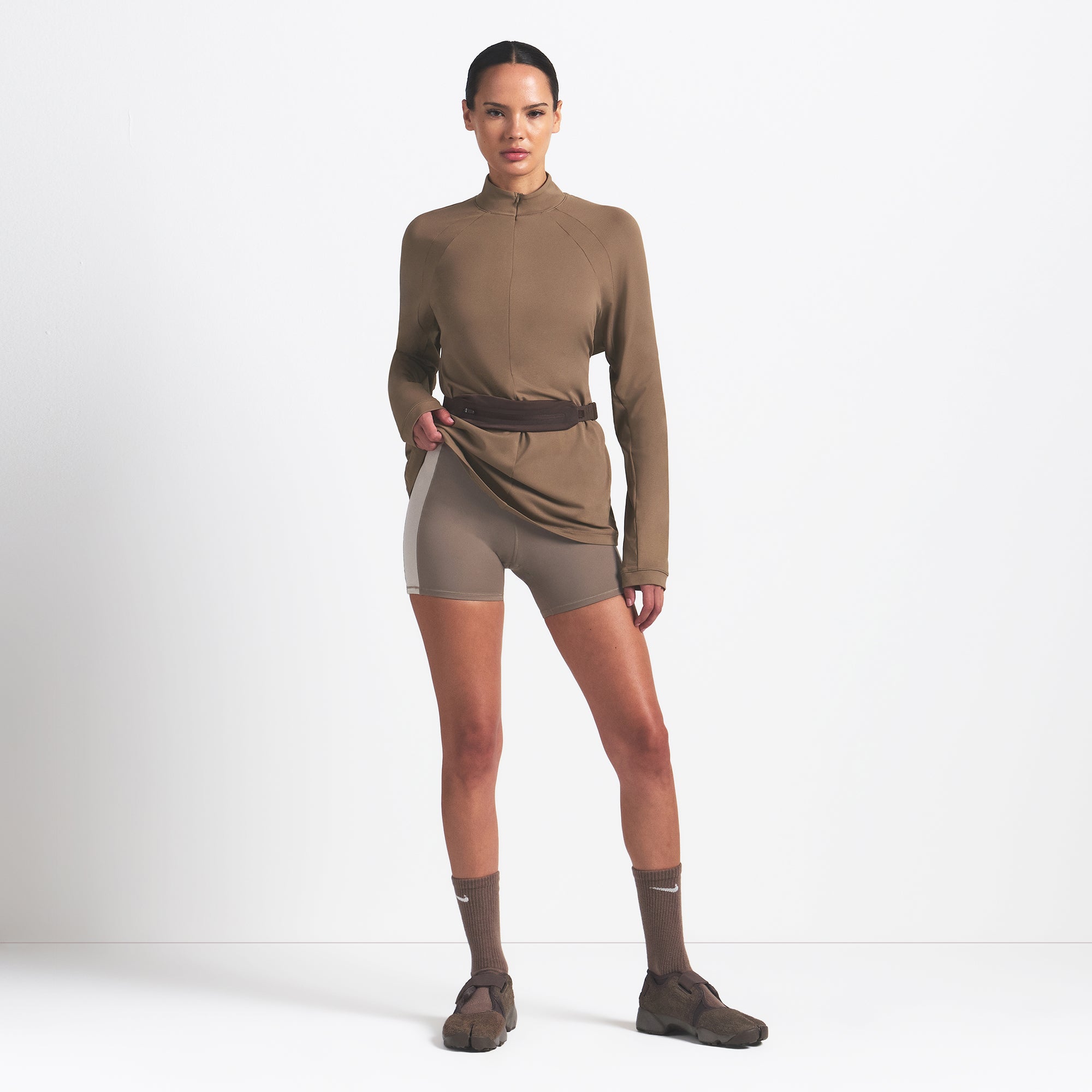 NikeSKIMS AIRY LONG SLEEVE HALF ZIP | MYRRH ON A MODEL FRONT VIEW @ | FOCUS: 0.0, 1.0, 0.9