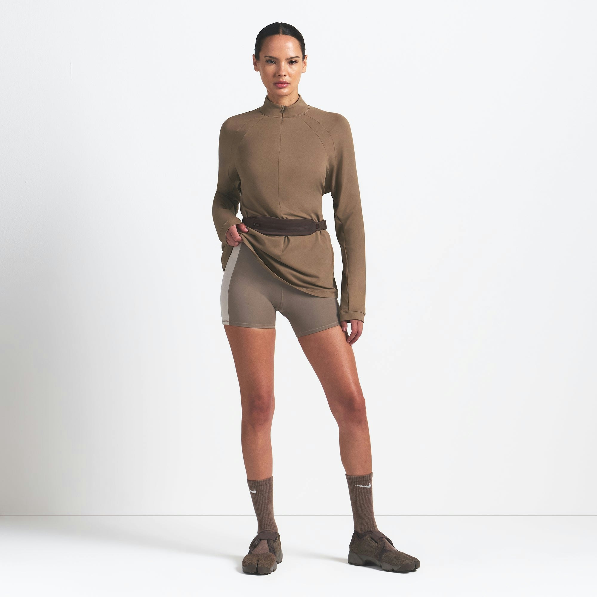 NikeSKIMS AIRY LONG SLEEVE HALF ZIP | MYRRH ON A MODEL FRONT VIEW @ | FOCUS: 0.0, 1.0, 0.9