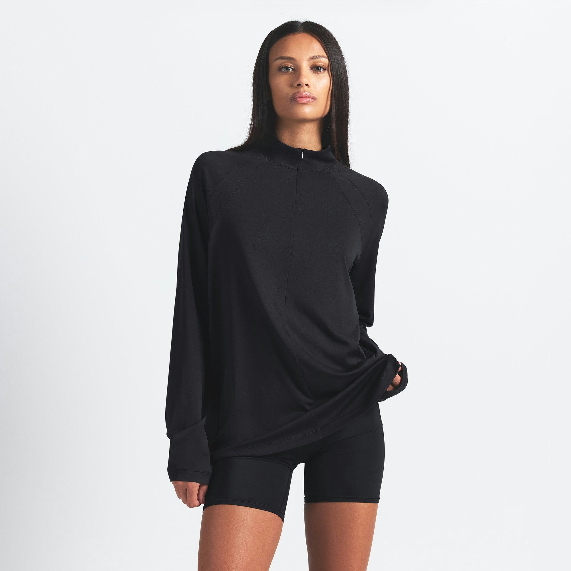 NikeSKIMS AIRY LONG SLEEVE HALF ZIP | OBSIDIAN ON A MODEL SIDE VIEW @ | FOCUS: 0.0, 1.0, 0.9