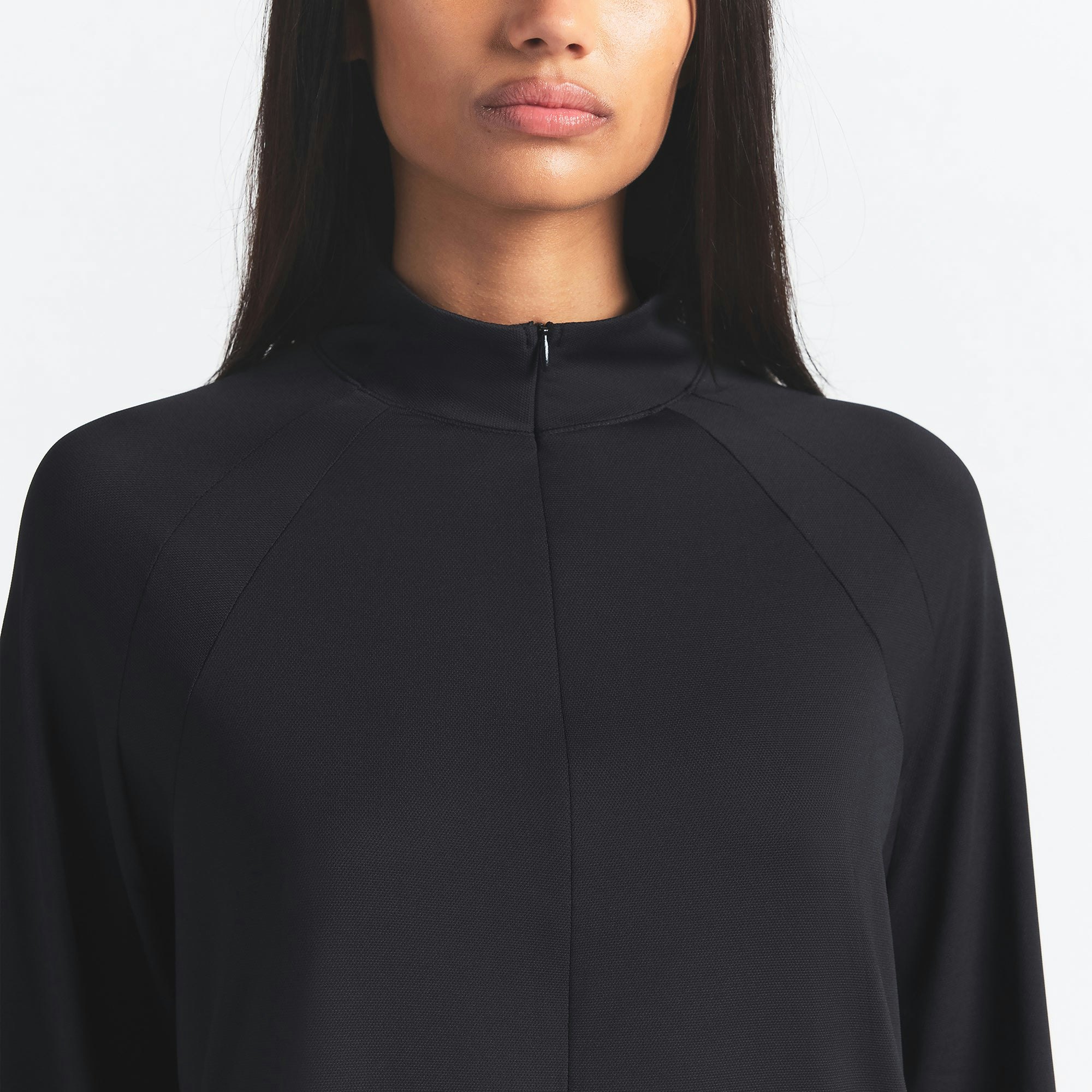 NikeSKIMS AIRY LONG SLEEVE HALF ZIP | OBSIDIAN ON A MODEL SIDE VIEW @ | FOCUS: 0.0, 1.0, 0.9