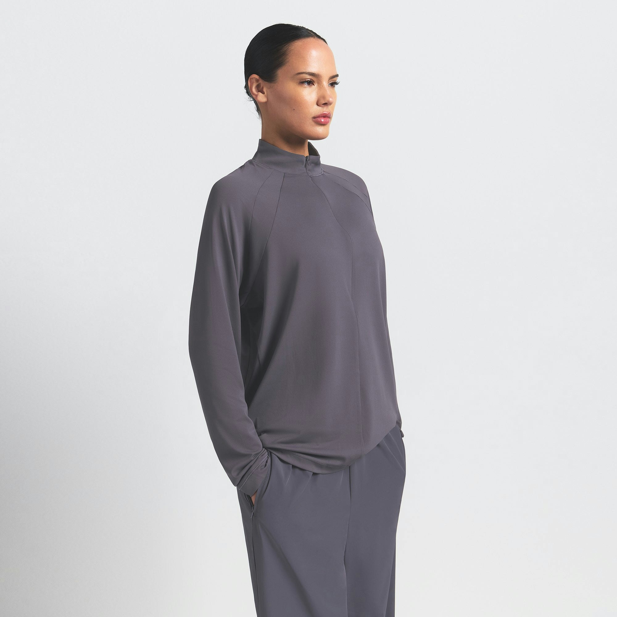 NikeSKIMS AIRY LONG SLEEVE HALF ZIP | RAVEN ON A MODEL SIDE VIEW @ | FOCUS: 0.0, 1.0, 0.9