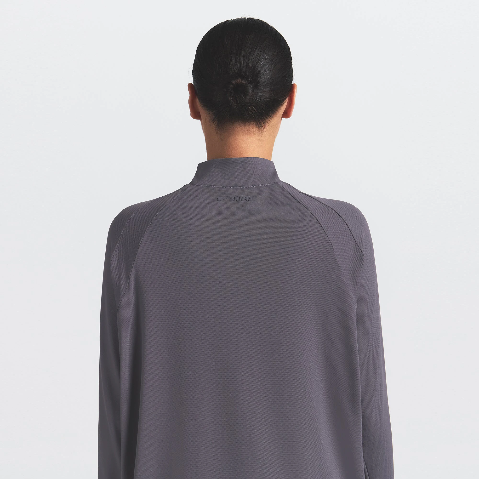 NikeSKIMS AIRY LONG SLEEVE HALF ZIP | RAVEN ON A MODEL SIDE VIEW @ | FOCUS: 0.0, 1.0, 0.9