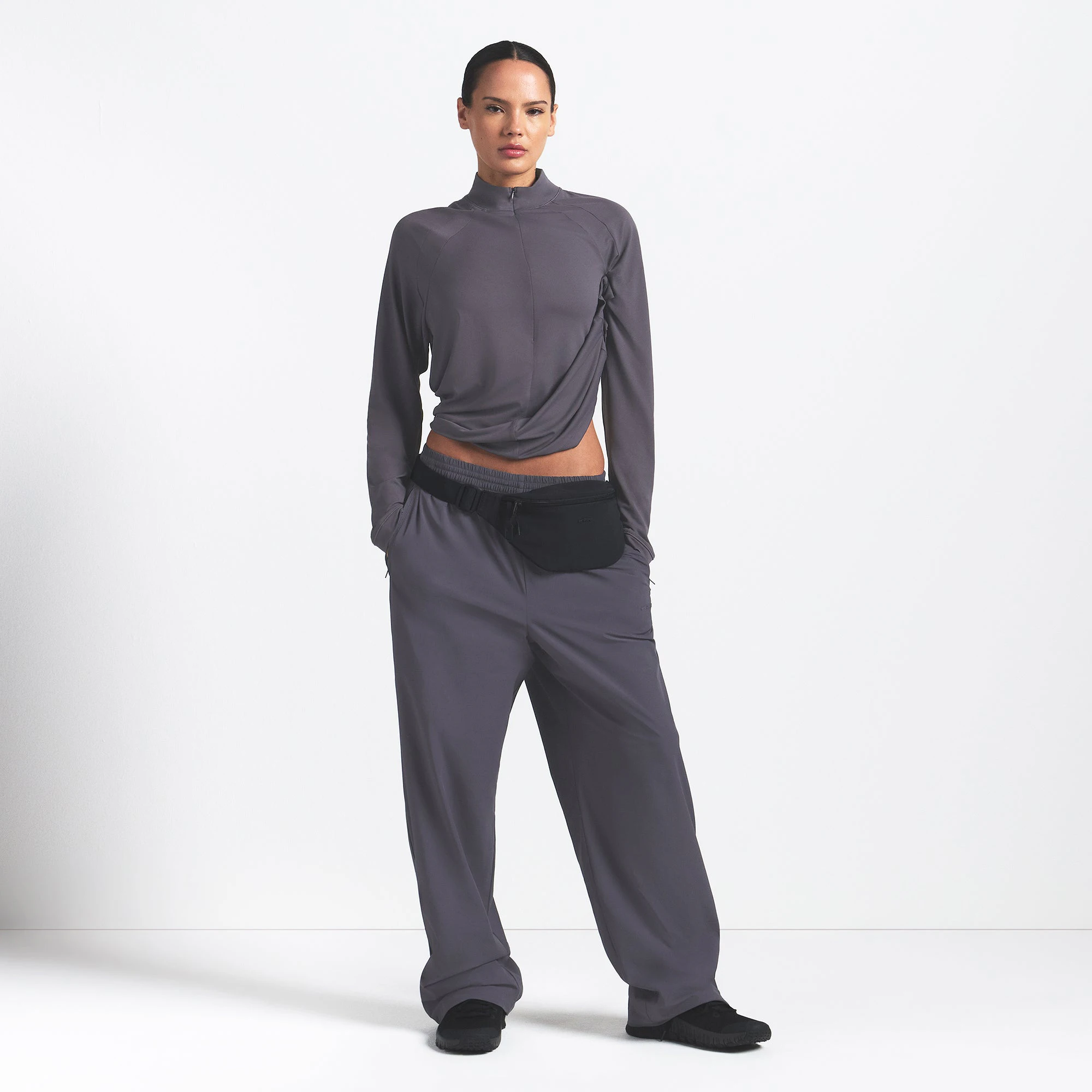 NikeSKIMS AIRY LONG SLEEVE HALF ZIP | RAVEN ON A MODEL FRONT VIEW @ | FOCUS: 0.0, 1.0, 0.9