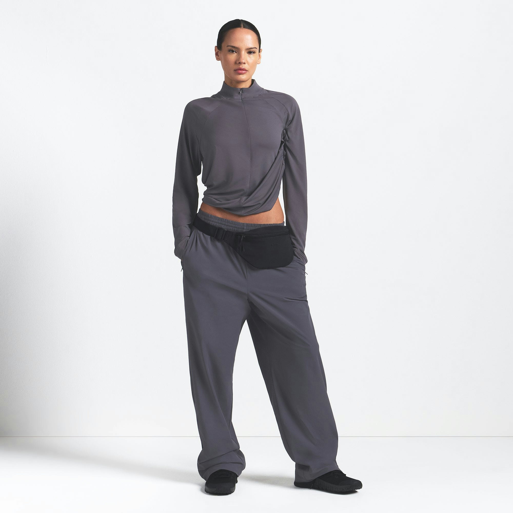 NikeSKIMS AIRY LONG SLEEVE HALF ZIP | RAVEN ON A MODEL FRONT VIEW @ | FOCUS: 0.0, 1.0, 0.9