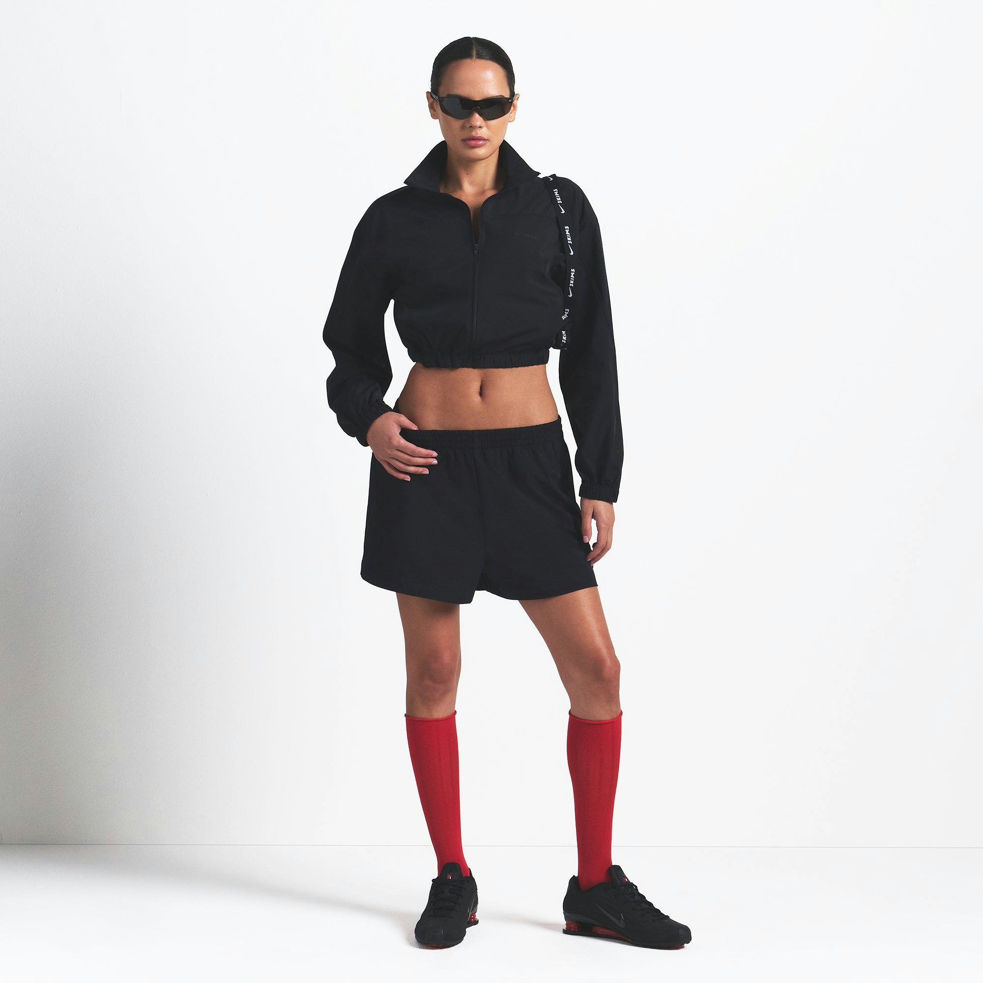 NikeSKIMS WOVEN NYLON CROP JACKET | OBSIDIAN ON A MODEL FRONT VIEW @ | FOCUS: 0.0, 1.0, 0.9