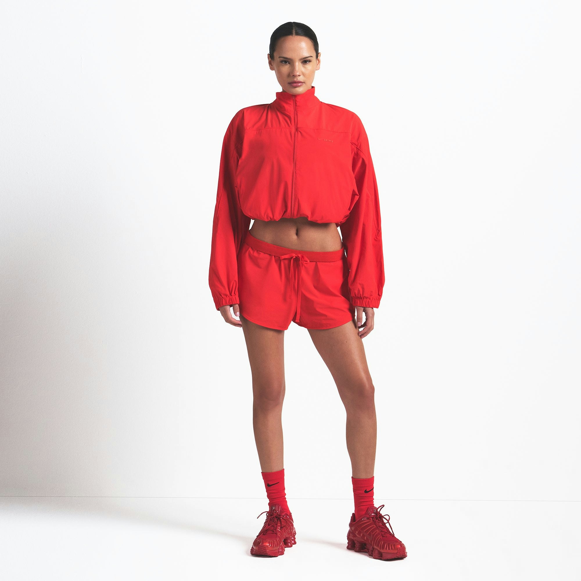 NikeSKIMS WOVEN NYLON CROP JACKET | RUBY ON A MODEL FRONT VIEW @ | FOCUS: 0.0, 1.0, 0.9