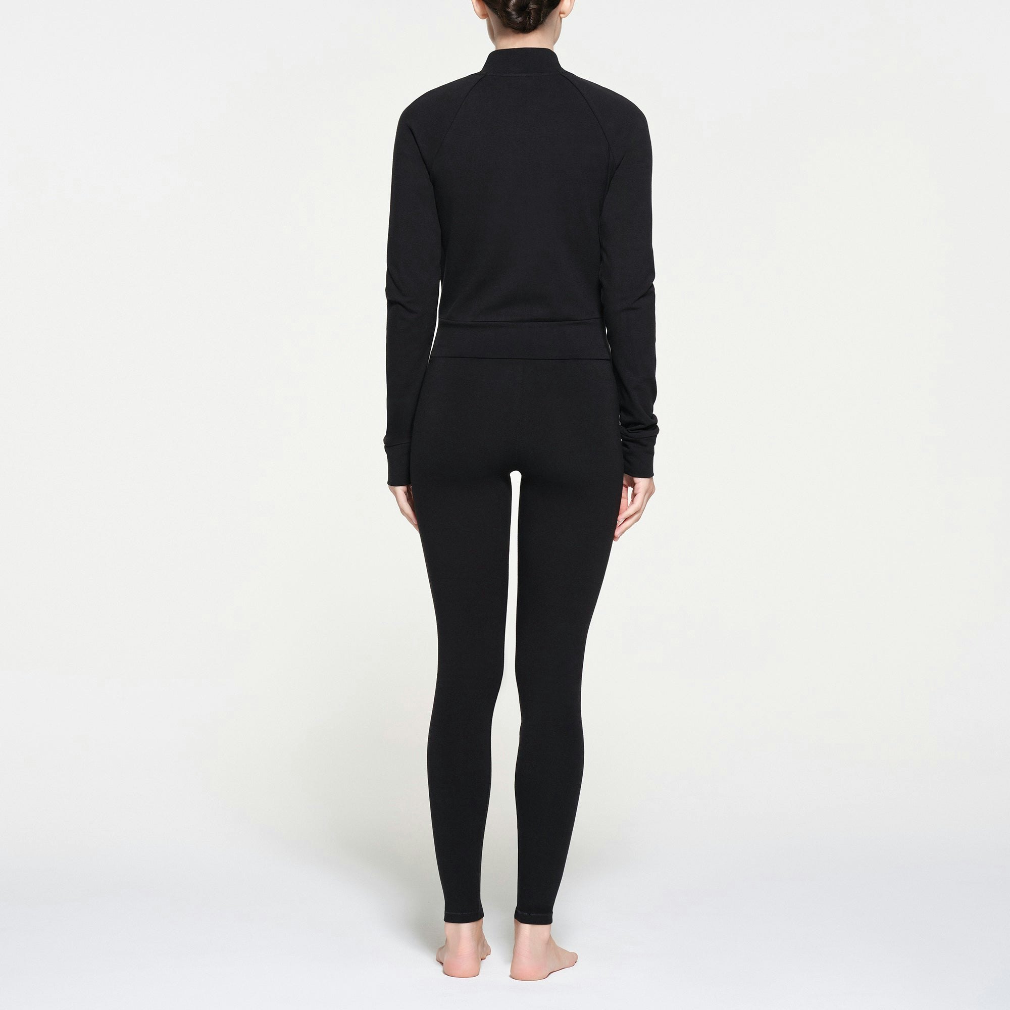 OUTDOOR TRACK JACKET | ONYX ON A MODEL BACK VIEW