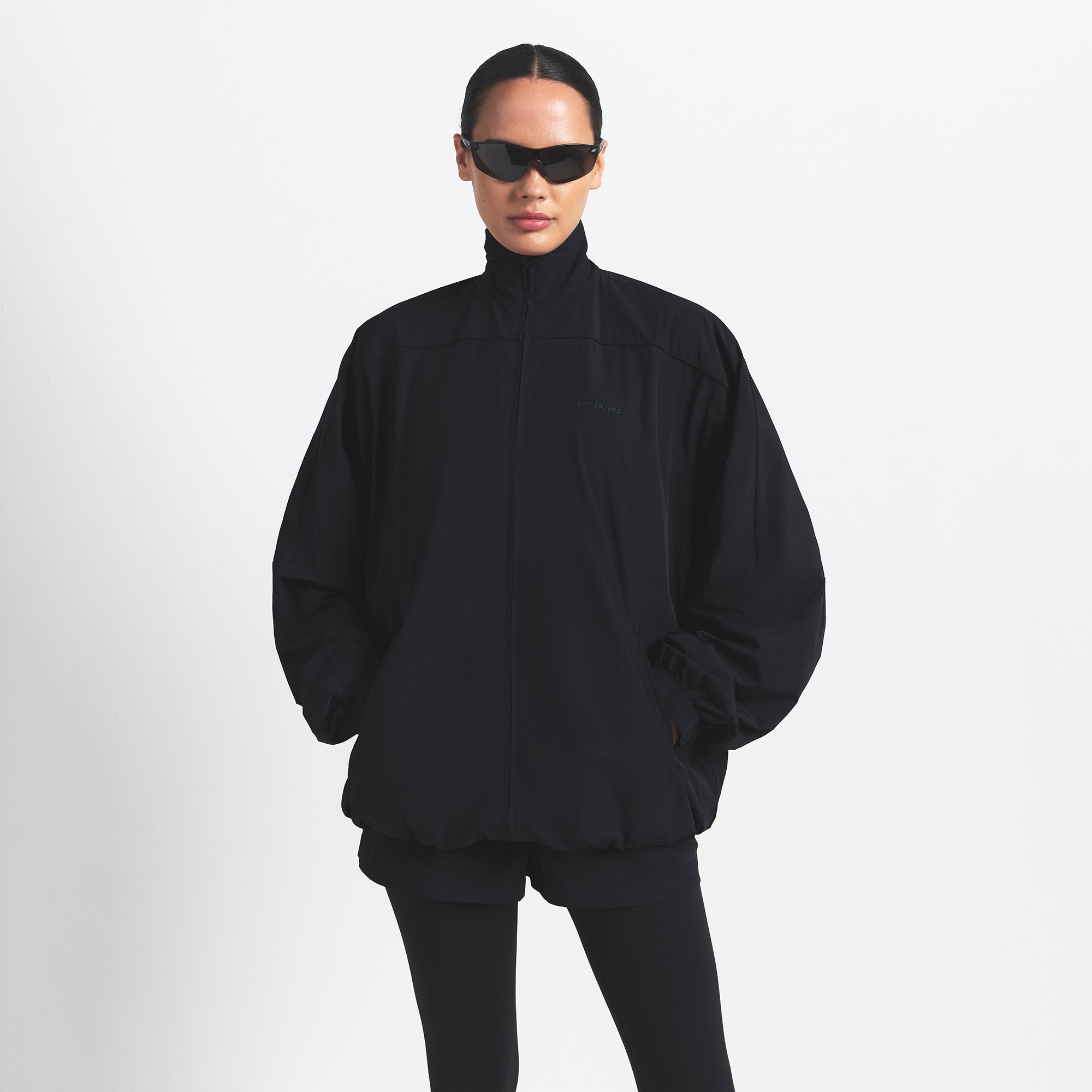 NikeSKIMS WOVEN NYLON OVERSIZED TRACK JACKET | OBSIDIAN