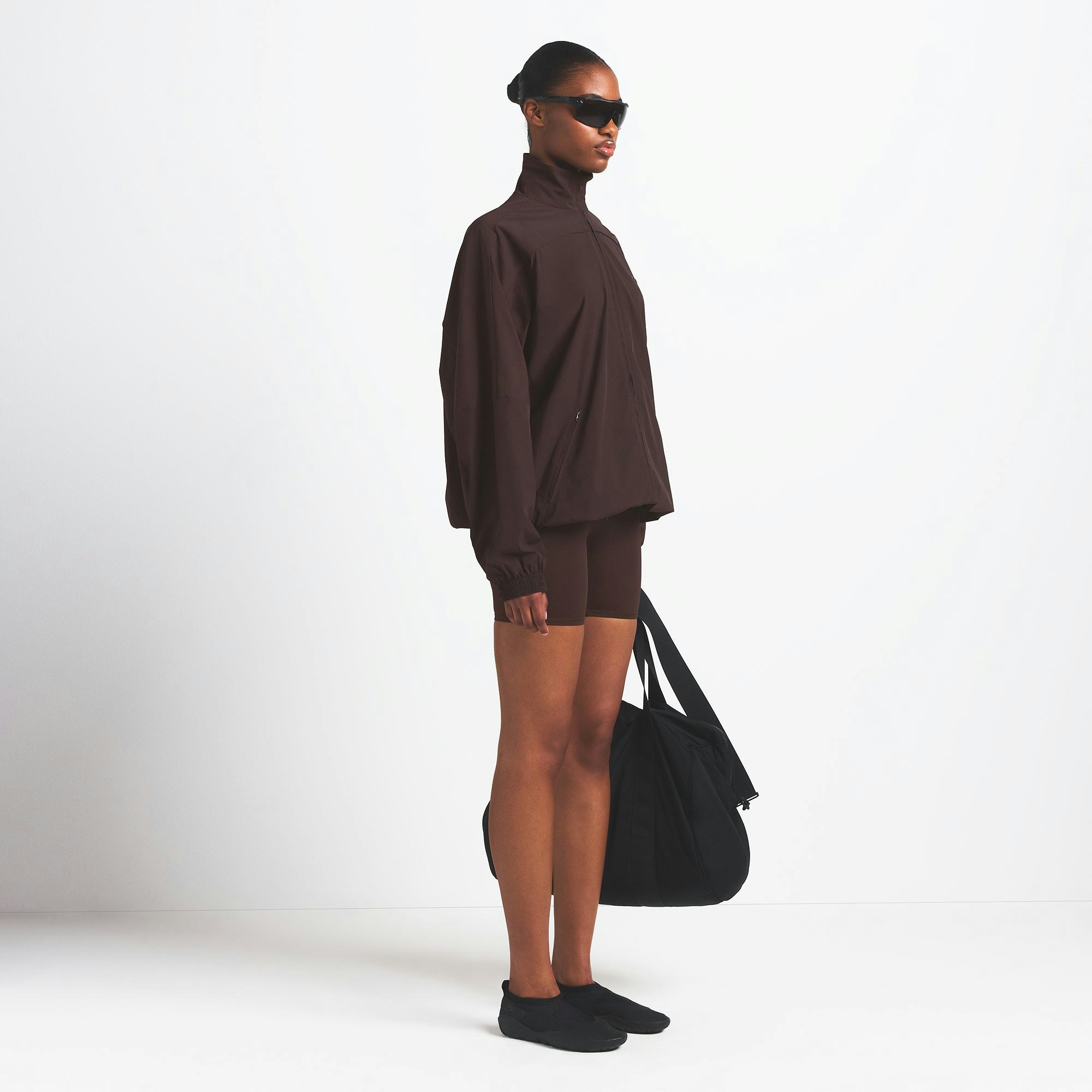 NikeSKIMS WOVEN NYLON OVERSIZED TRACK JACKET | PHOENIX ON A MODEL SIDE VIEW @ | FOCUS: 0.0, 1.0, 0.9