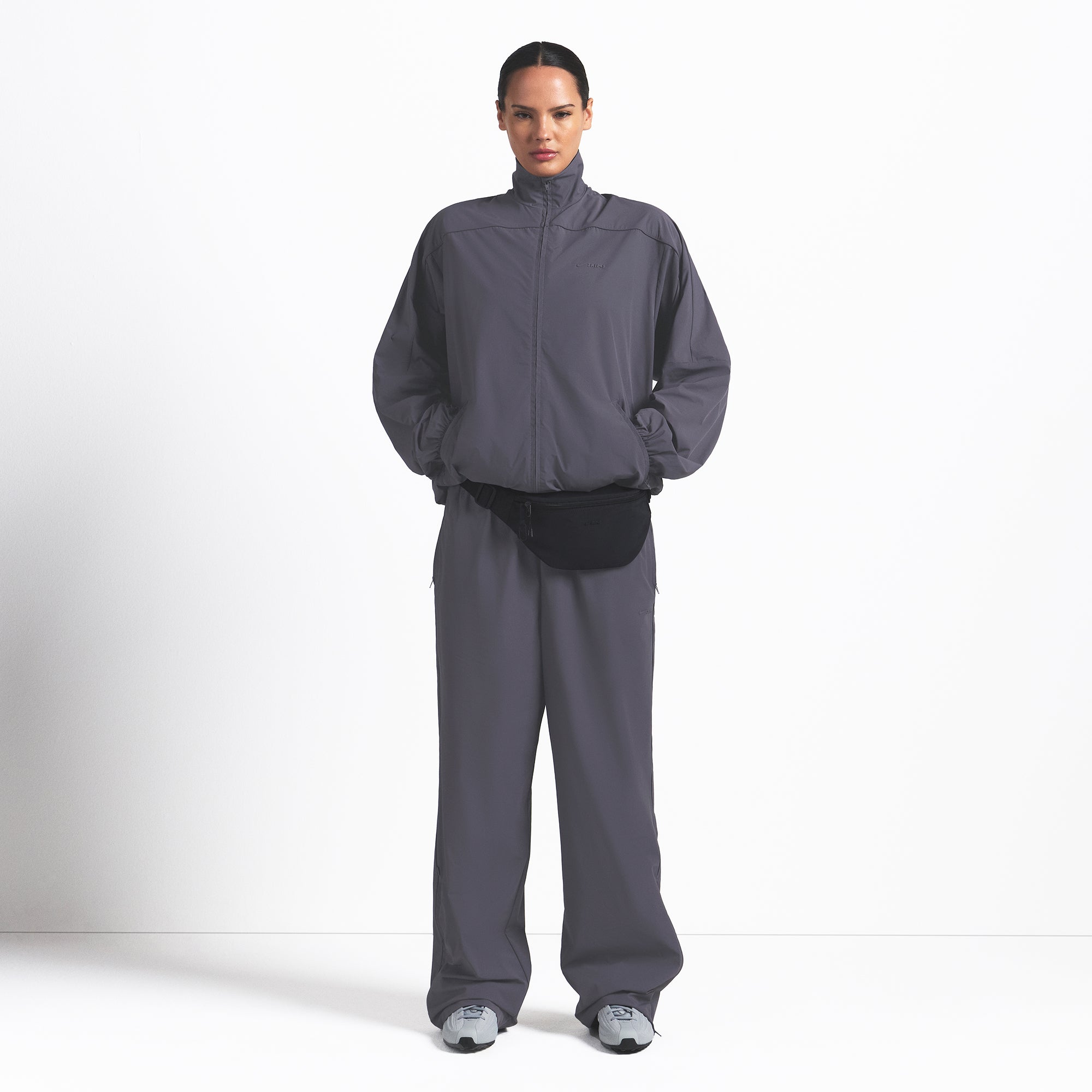 NikeSKIMS WOVEN NYLON OVERSIZED TRACK JACKET | RAVEN ON A MODEL FRONT VIEW @ | FOCUS: 0.0, 1.0, 0.9