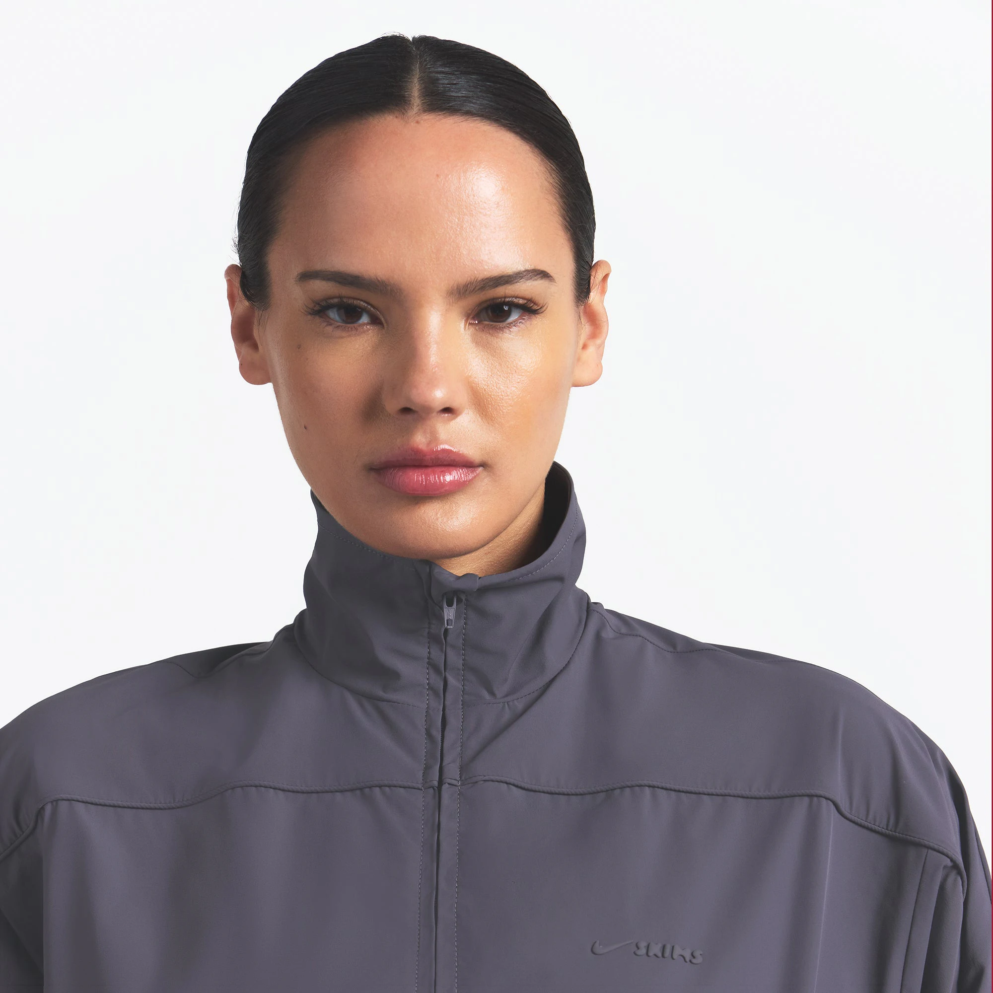 NikeSKIMS WOVEN NYLON OVERSIZED TRACK JACKET | RAVEN ON A MODEL FRONT VIEW @ | FOCUS: 0.0, 1.0, 0.9