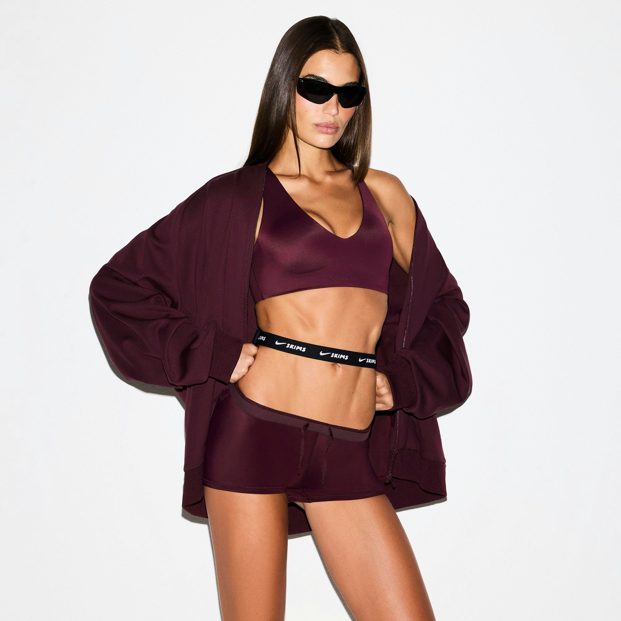 NikeSKIMS MATTE TRICOT OVERSIZED TRACK JACKET | CURRANT ON A MODEL SIDE VIEW @ | FOCUS: 0.0, 1.0, 0.9