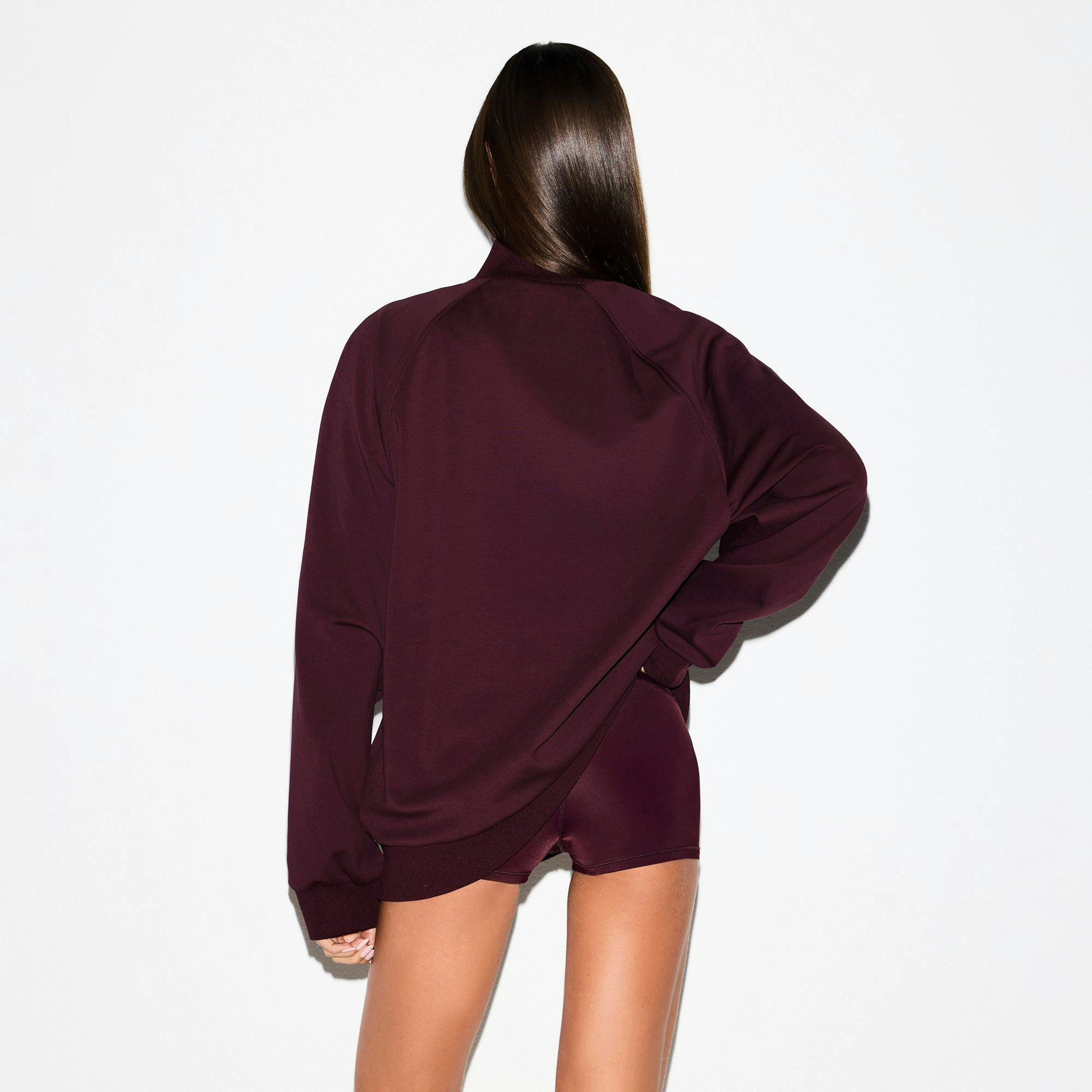 NikeSKIMS MATTE TRICOT OVERSIZED TRACK JACKET | CURRANT ON A MODEL SIDE VIEW @ | FOCUS: 0.0, 1.0, 0.9