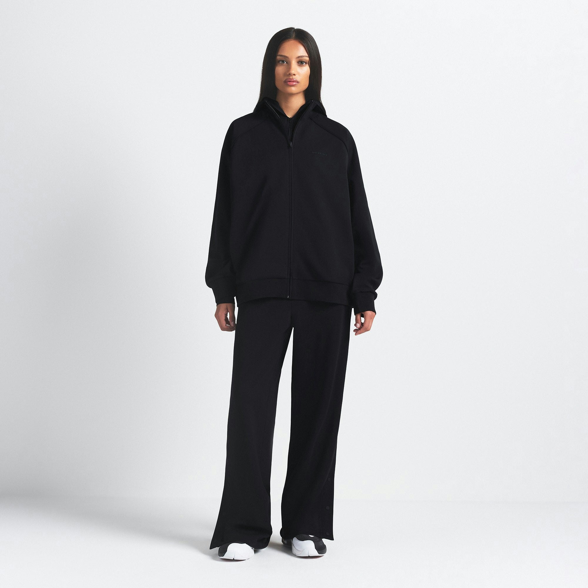 NikeSKIMS MATTE TRICOT OVERSIZED TRACK JACKET | OBSIDIAN ON A MODEL FRONT VIEW @ | FOCUS: 0.9, 0.1, 0.7