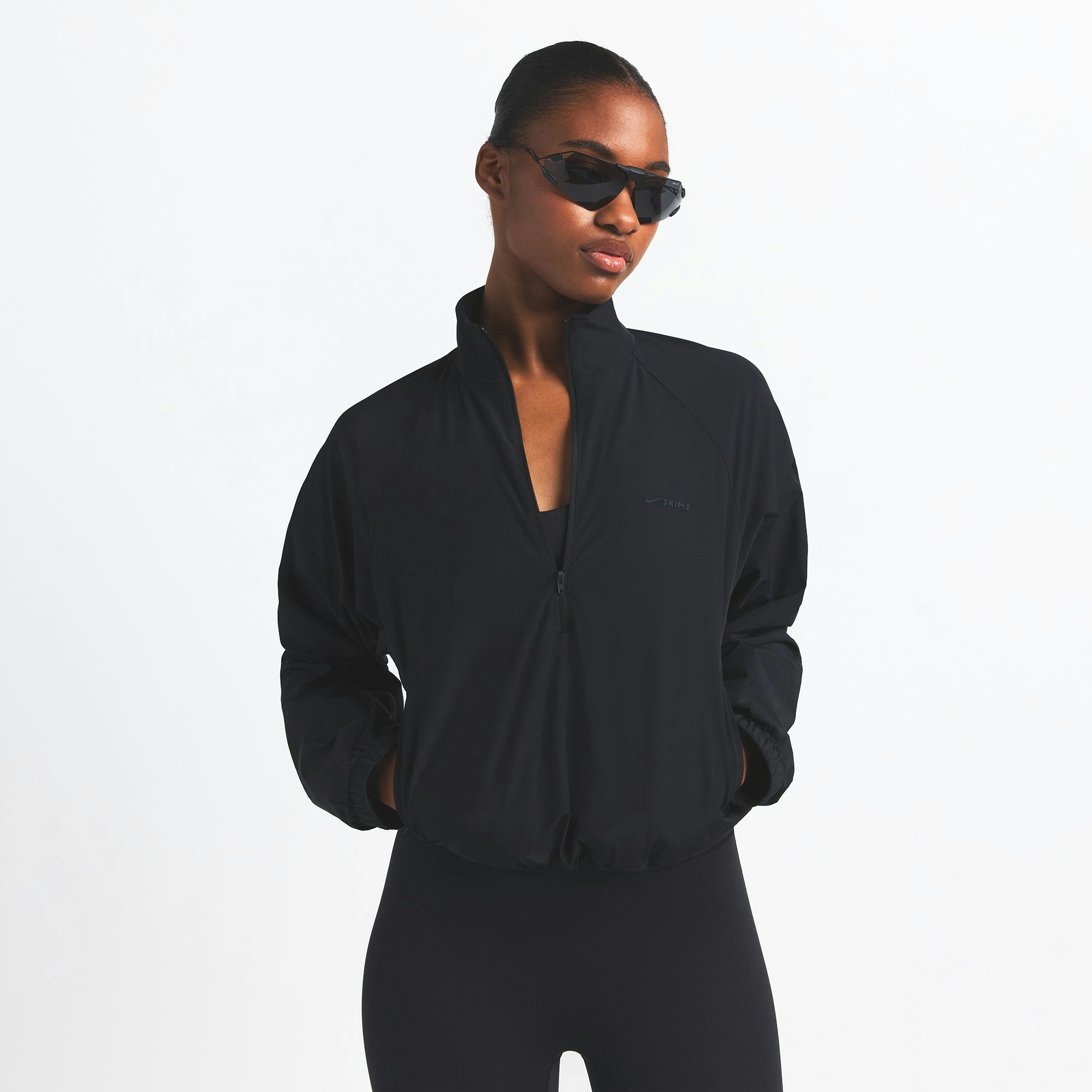 NikeSKIMS WOVEN NYLON HALF ZIP JACKET | OBSIDIAN ON A MODEL FRONT VIEW @ | FOCUS: 0.0, 1.0, 0.9