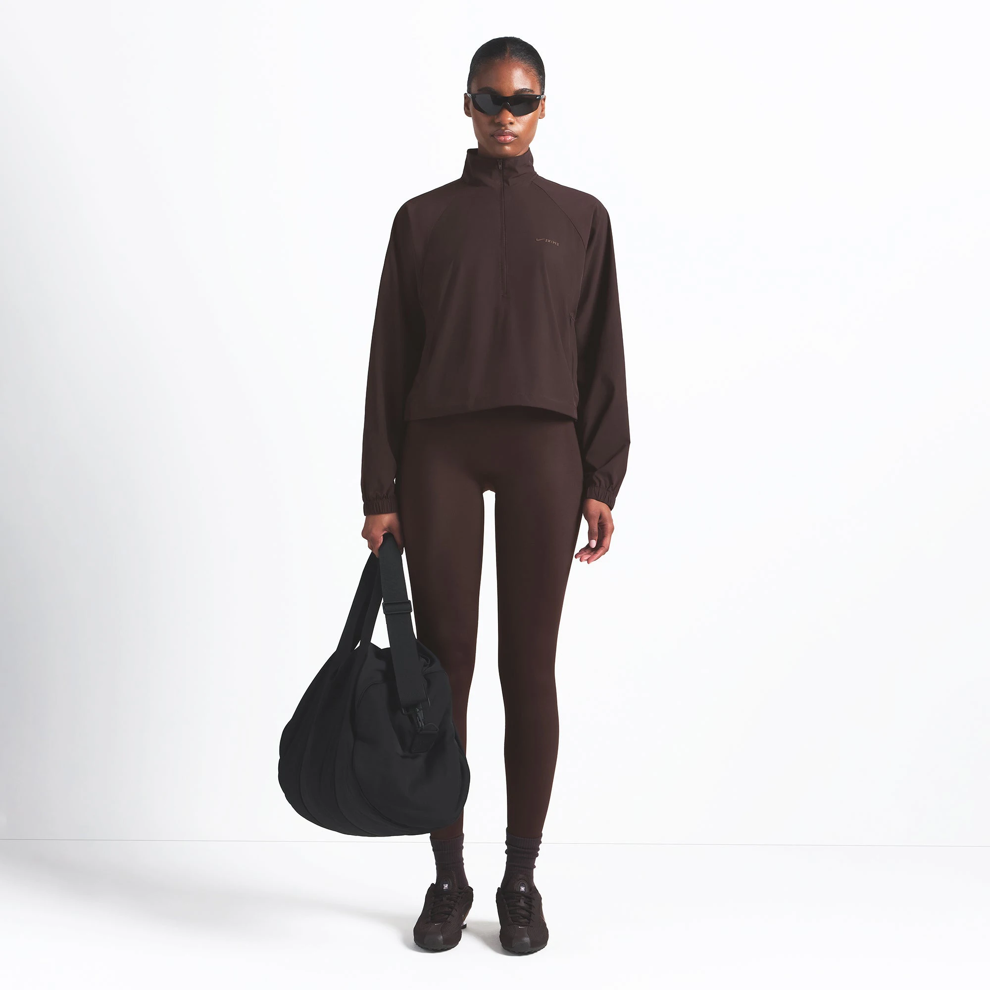 NikeSKIMS WOVEN NYLON HALF ZIP JACKET | PHOENIX ON A MODEL FRONT VIEW @ | FOCUS: 0.0, 1.0, 0.9