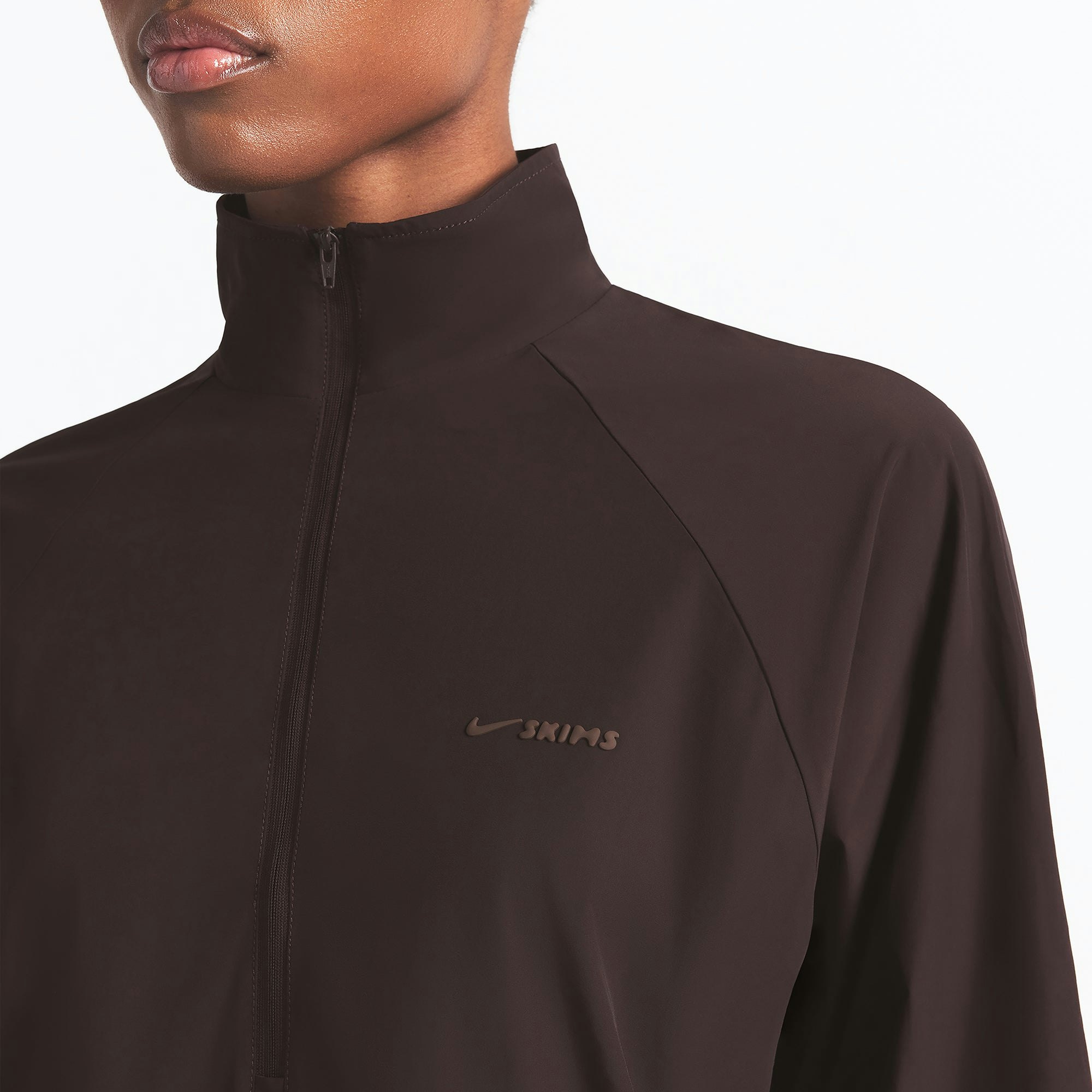 NikeSKIMS WOVEN NYLON HALF ZIP JACKET | PHOENIX ON A MODEL FRONT VIEW @ | FOCUS: 0.0, 1.0, 0.9