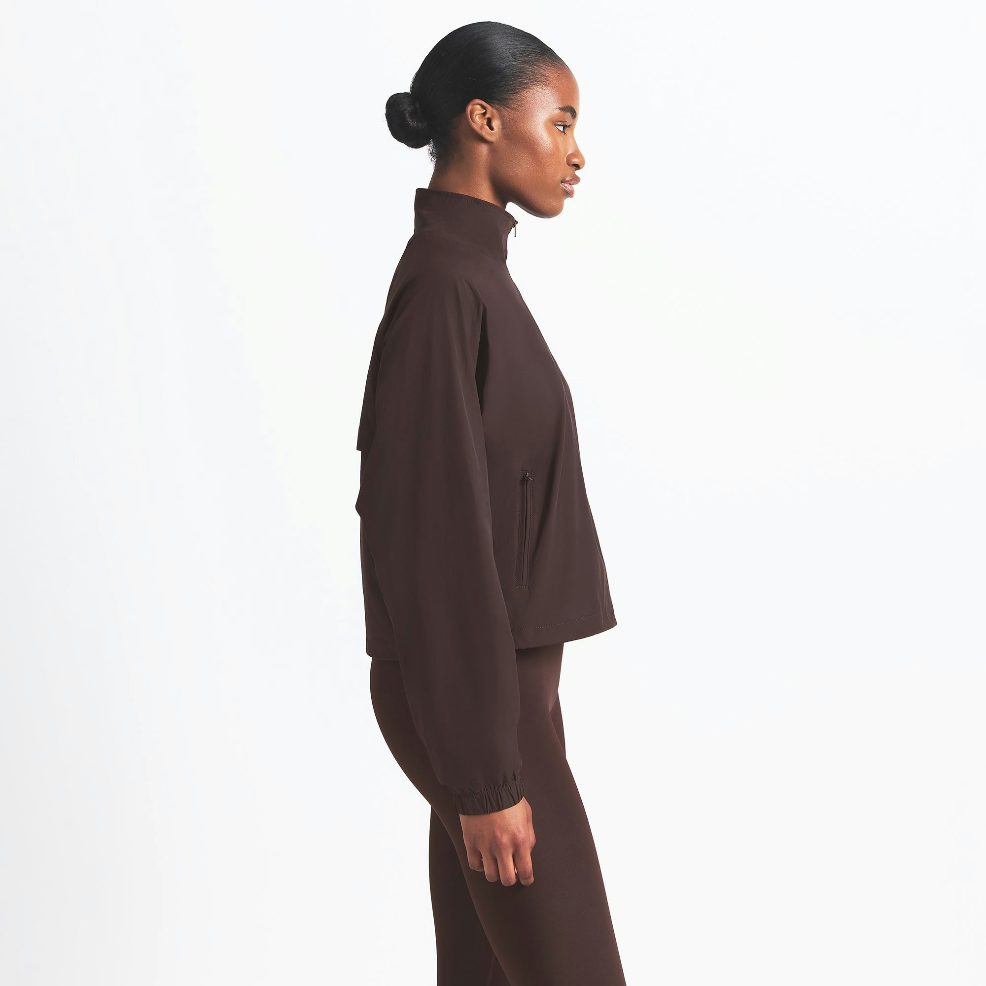 NikeSKIMS WOVEN NYLON HALF ZIP JACKET | PHOENIX ON A MODEL SIDE VIEW @ | FOCUS: 0.0, 1.0, 0.9