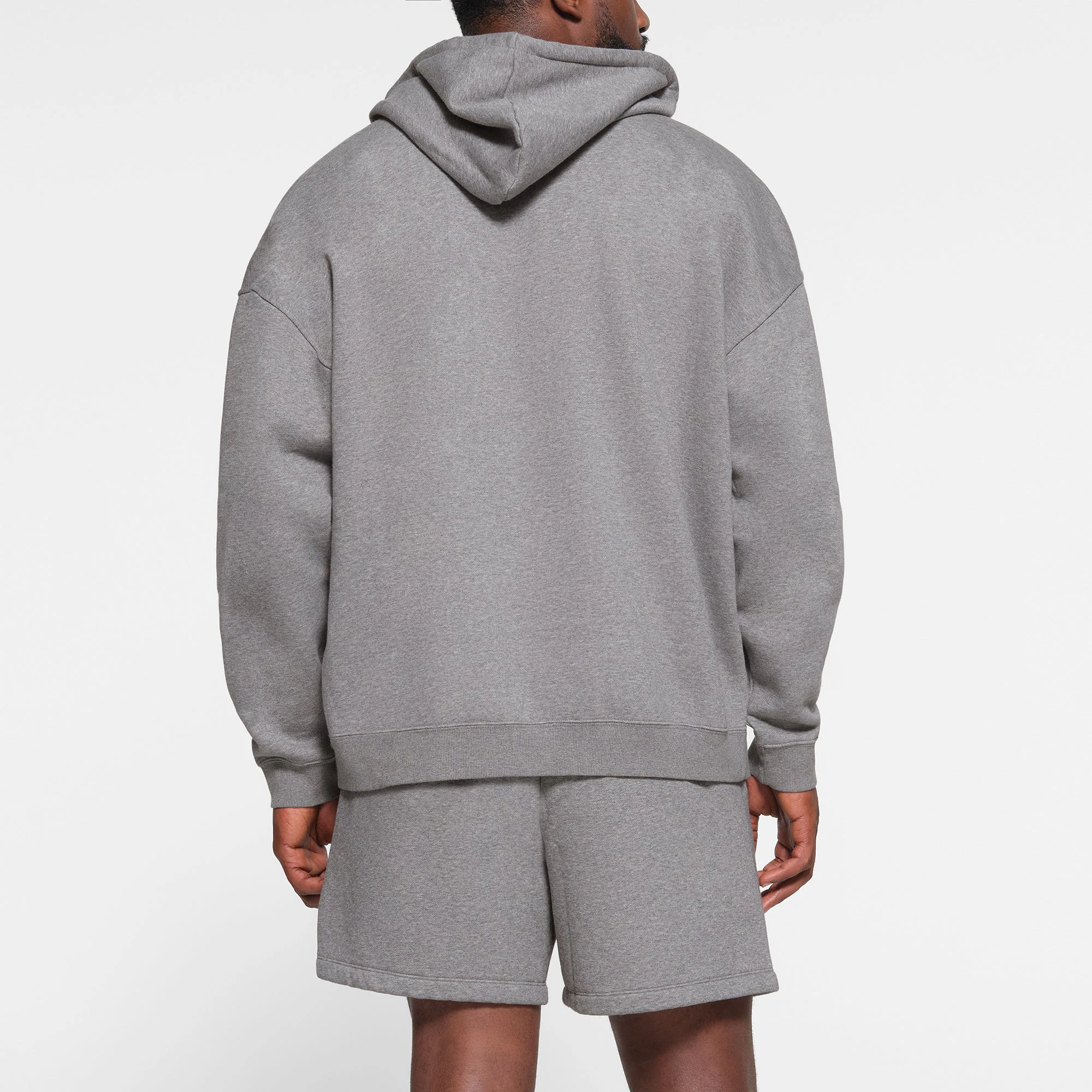 LOUNGE FLEECE MENS RELAXED ZIP UP HOODIE | DARK HEATHER GREY ON A MODEL BACK VIEW