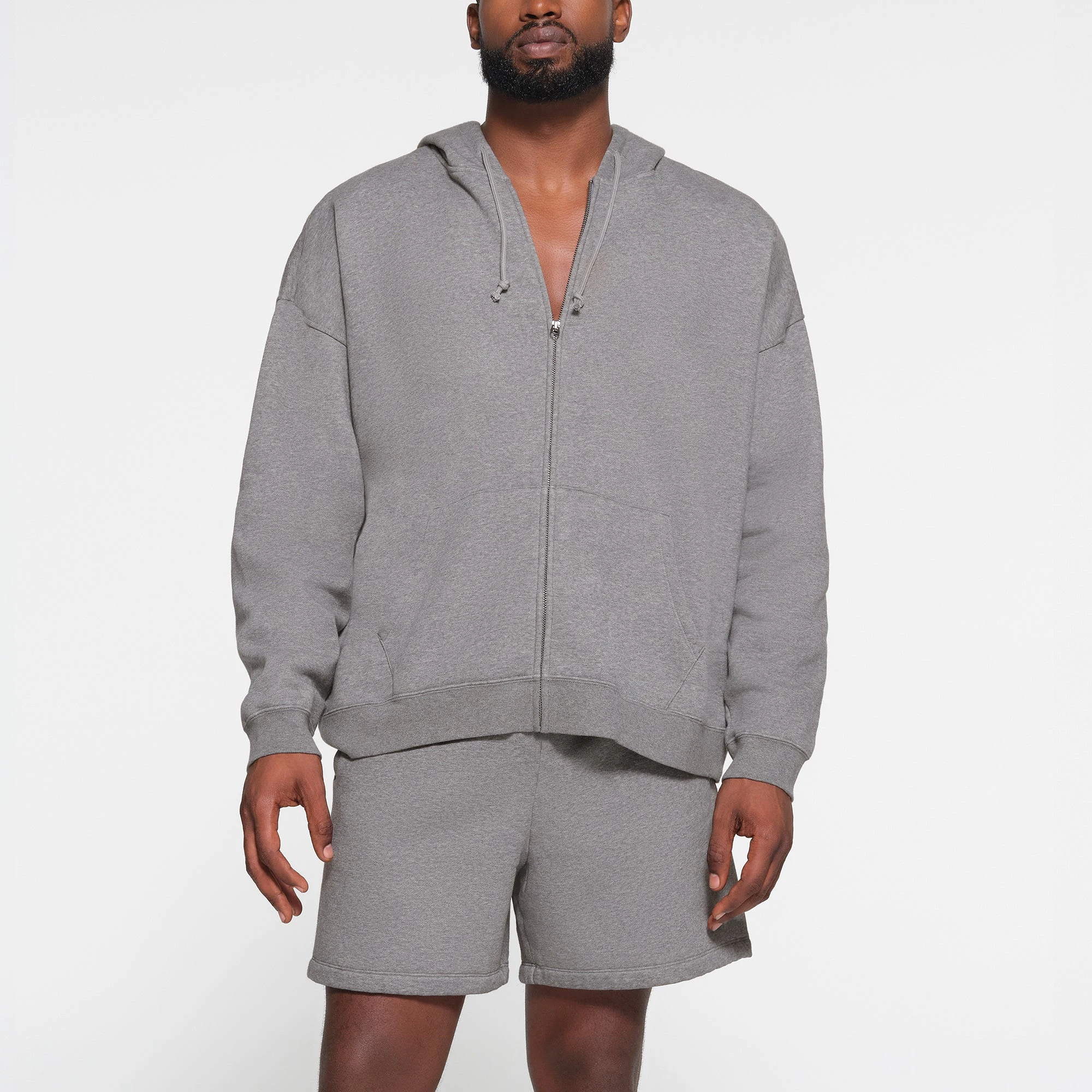 LOUNGE FLEECE MENS RELAXED ZIP UP HOODIE | DARK HEATHER GREY ON A MODEL FRONT VIEW