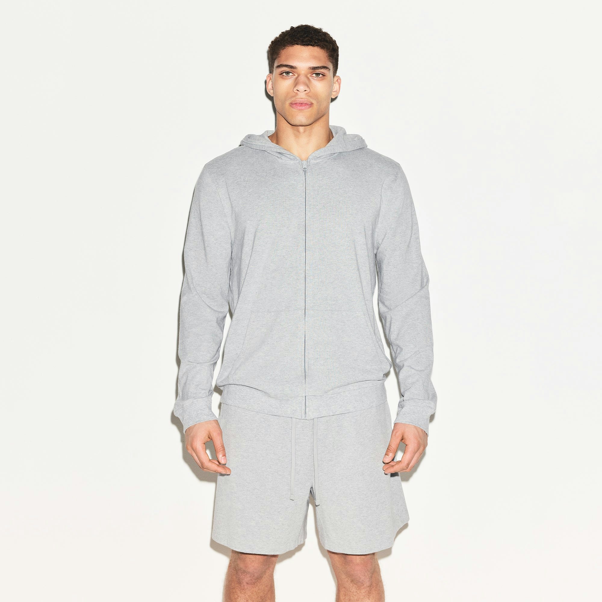 JERSEY LOUNGE MENS ZIP UP HOODIE | HEATHER GREY ON A MODEL FRONT VIEW | FOCUS: 0.0, 1.0, 0.9