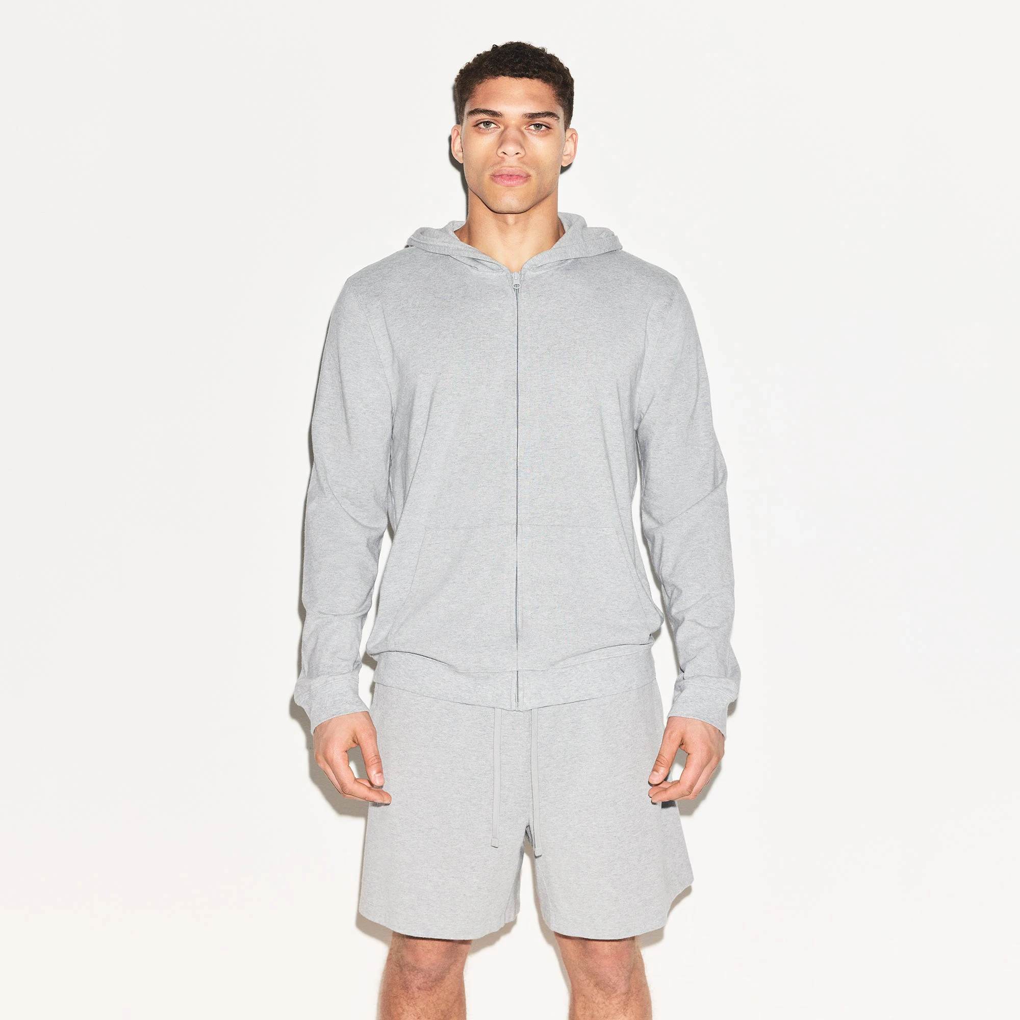 JERSEY LOUNGE MENS ZIP UP HOODIE | HEATHER GREY ON A MODEL FRONT VIEW | FOCUS: 0.0, 1.0, 0.9