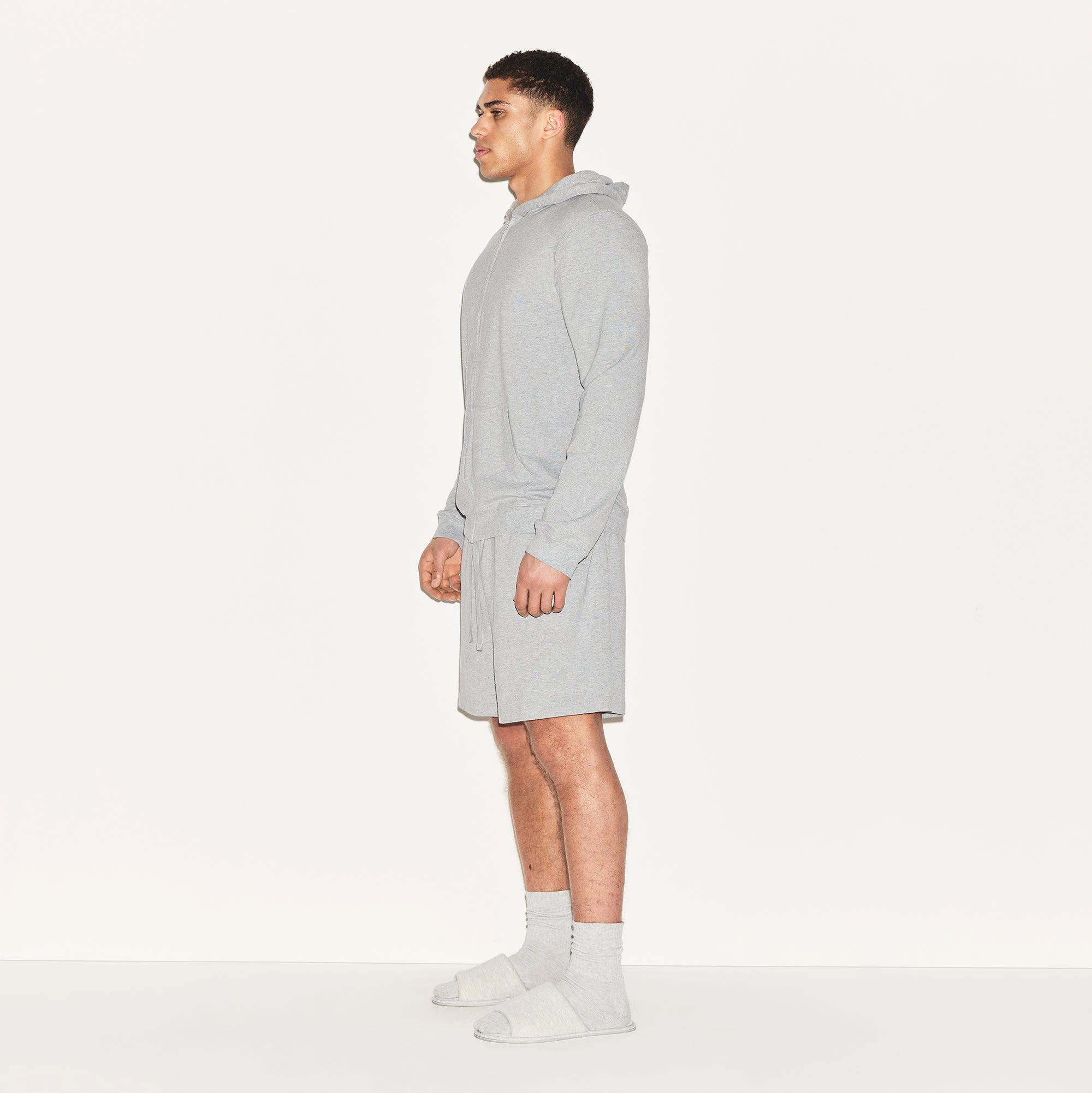 JERSEY LOUNGE MENS ZIP UP HOODIE | HEATHER GREY ON A MODEL SIDE VIEW | FOCUS: 0.0, 1.0, 0.9