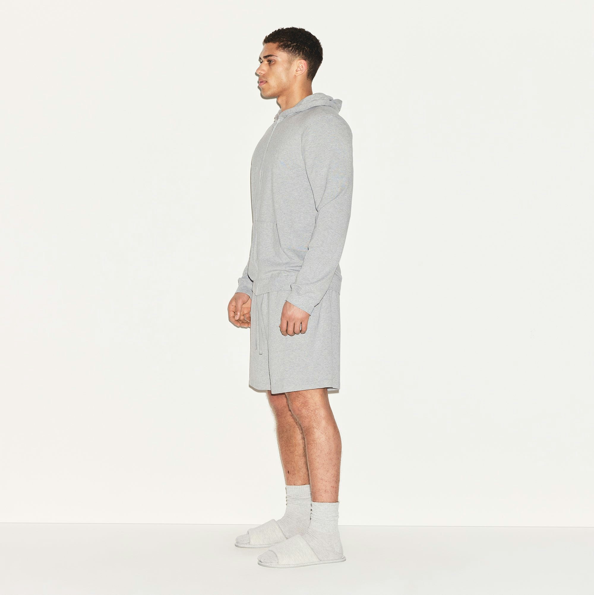 JERSEY LOUNGE MENS ZIP UP HOODIE | HEATHER GREY ON A MODEL SIDE VIEW | FOCUS: 0.0, 1.0, 0.9