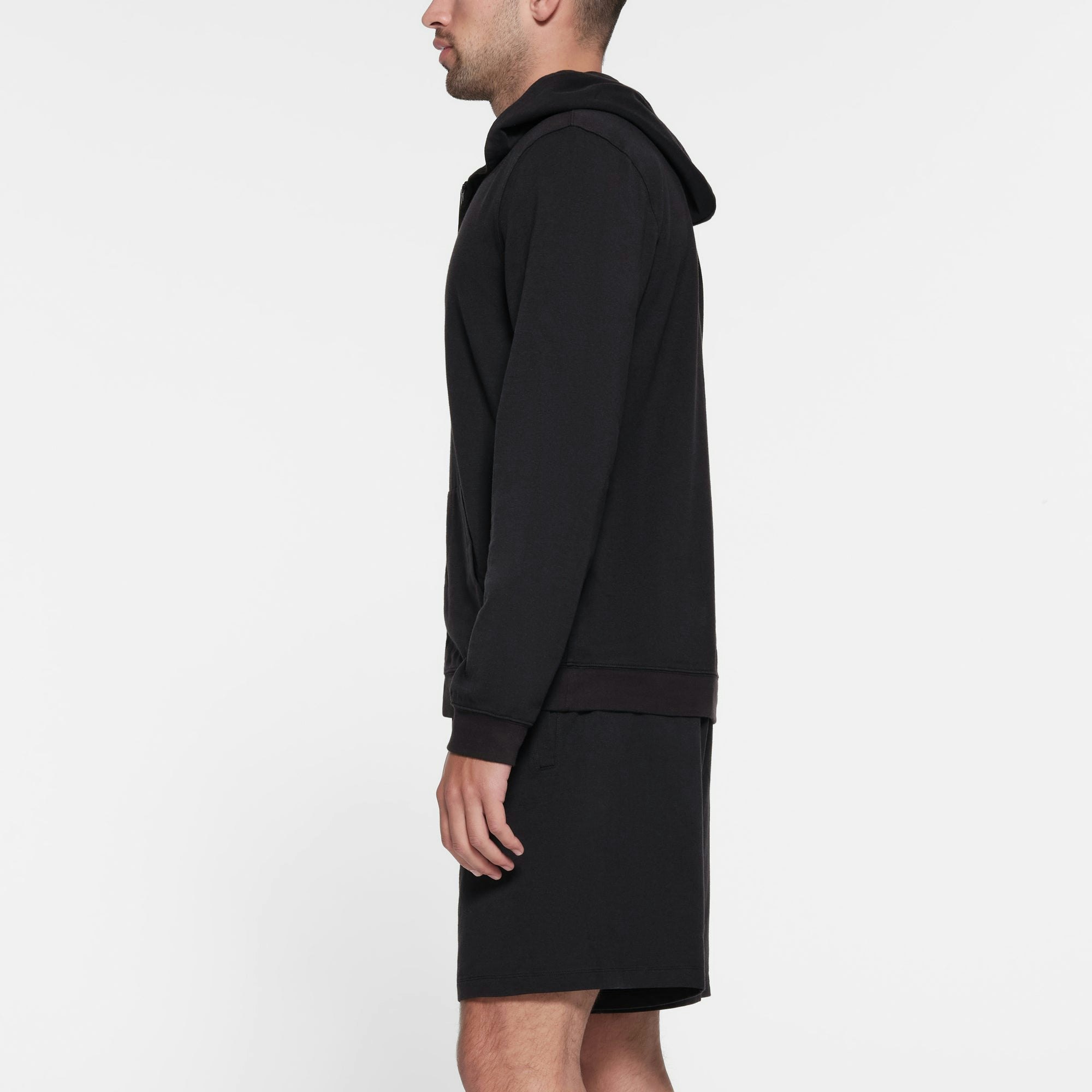 JERSEY LOUNGE MENS ZIP UP HOODIE | OBSIDIAN ON A MODEL SIDE VIEW