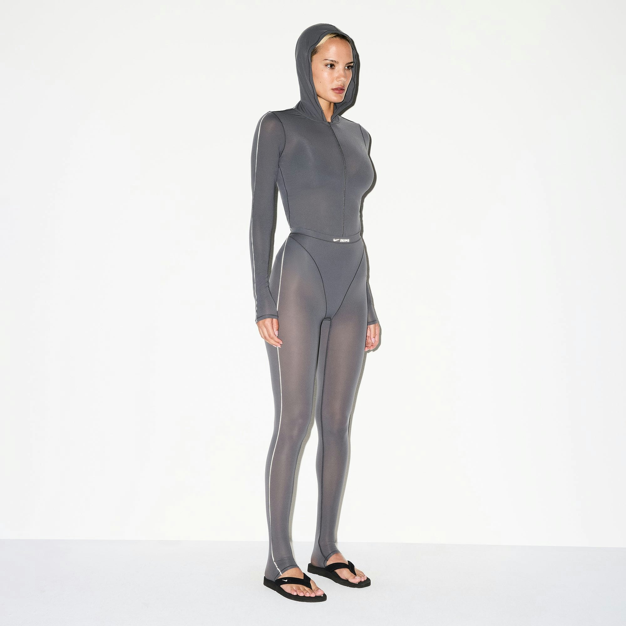 NikeSKIMS WEIGHTLESS LAYERS ZIP UP HOODIE | LEAD ON A MODEL SIDE VIEW