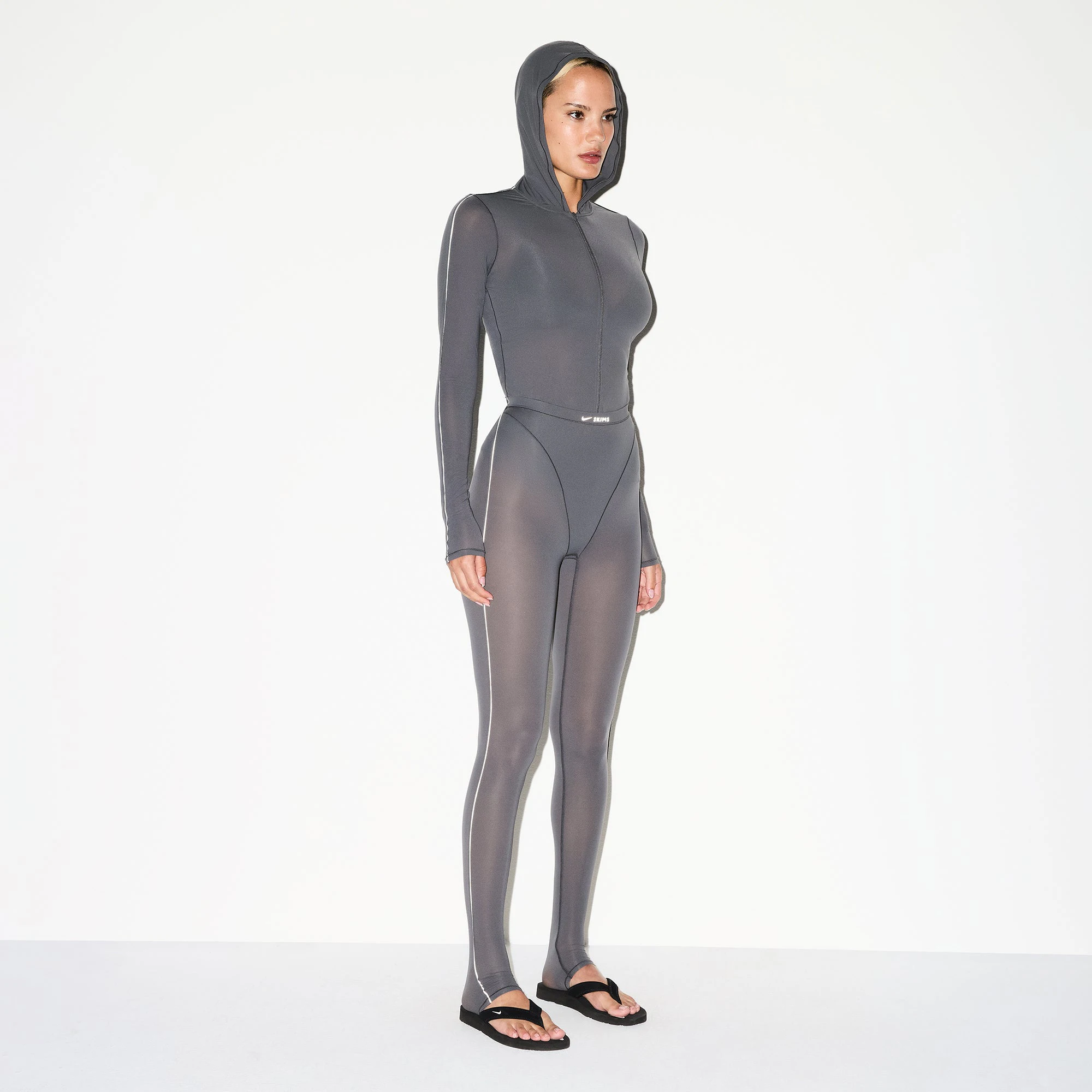 NikeSKIMS WEIGHTLESS LAYERS ZIP UP HOODIE | LEAD ON A MODEL SIDE VIEW @ | FOCUS: 0.0, 1.0, 0.9