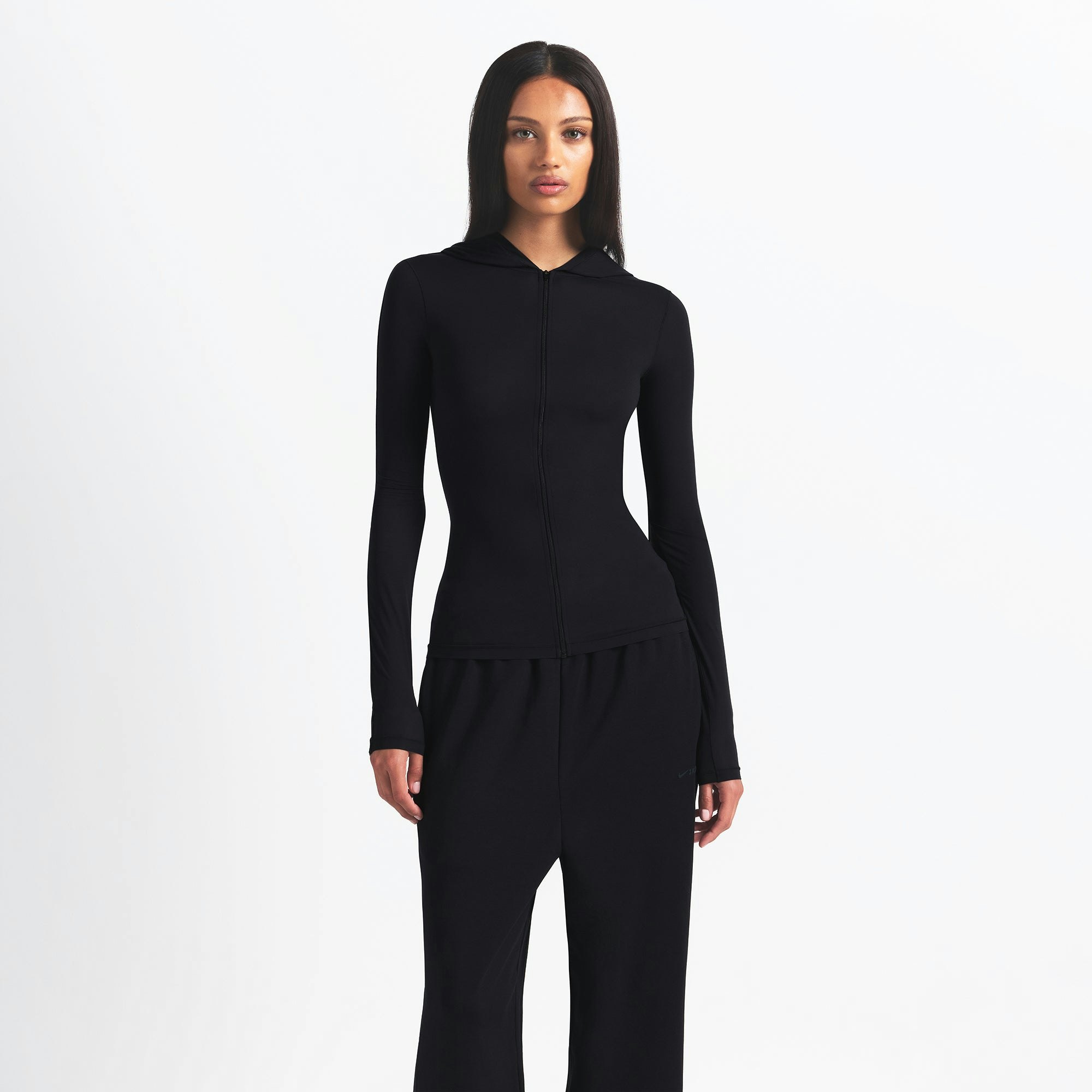 NikeSKIMS WEIGHTLESS LAYERS ZIP UP HOODIE | OBSIDIAN ON A MODEL FRONT VIEW @ | FOCUS: 0.9, 0.1, 0.7