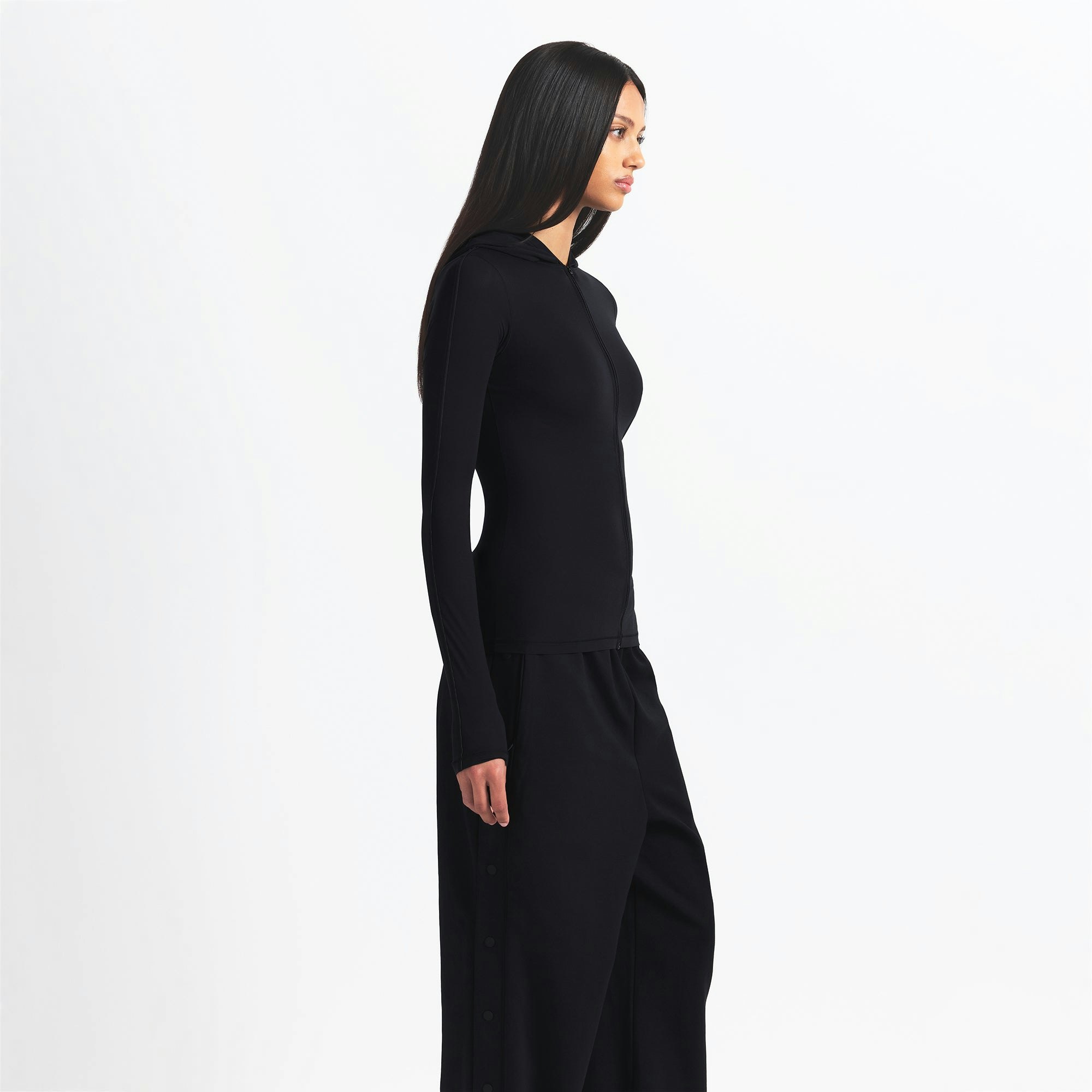 NikeSKIMS WEIGHTLESS LAYERS ZIP UP HOODIE | OBSIDIAN ON A MODEL SIDE VIEW