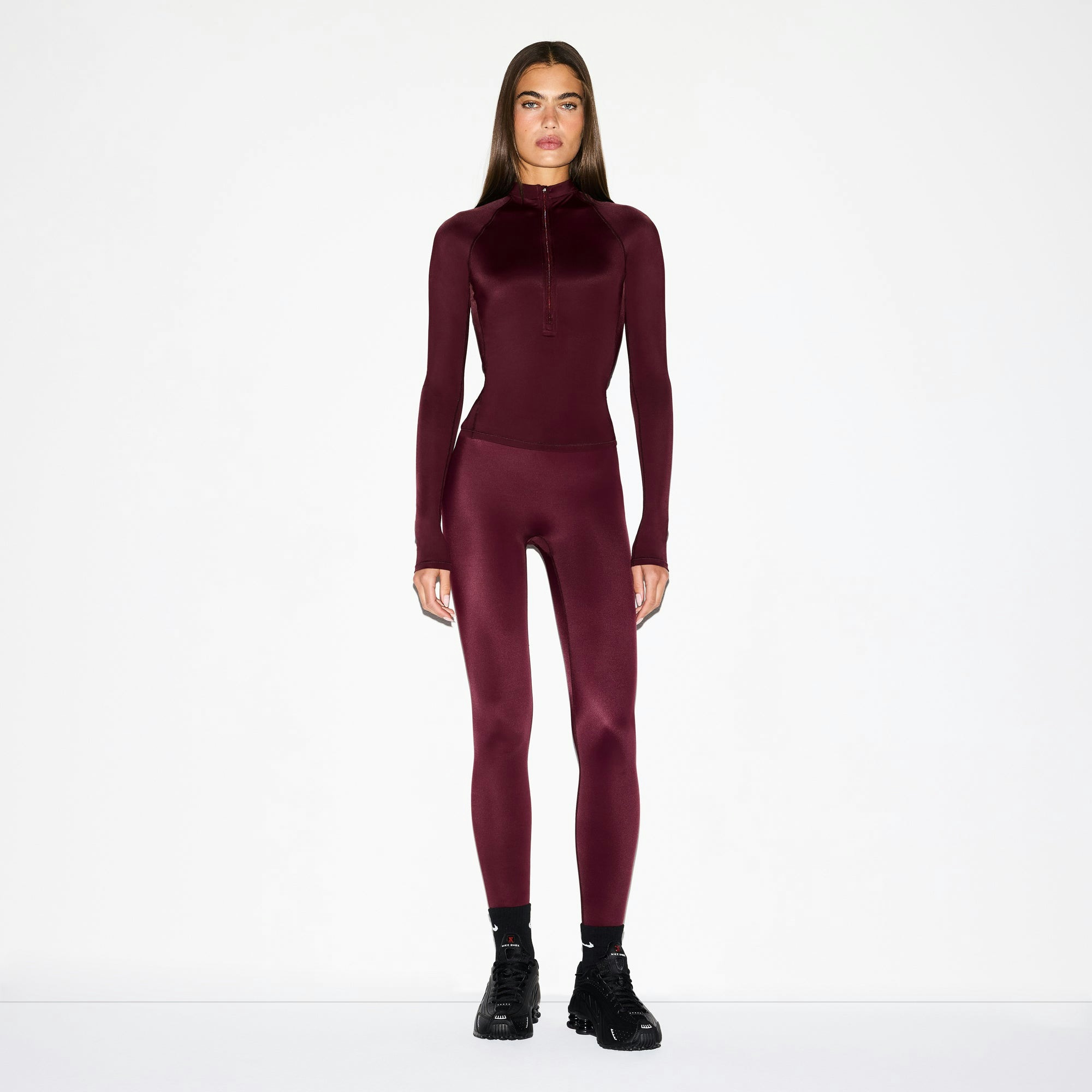 NikeSKIMS SHINE LONG SLEEVE HALF ZIP | CURRANT ON A MODEL FRONT VIEW @ | FOCUS: 0.0, 1.0, 0.9