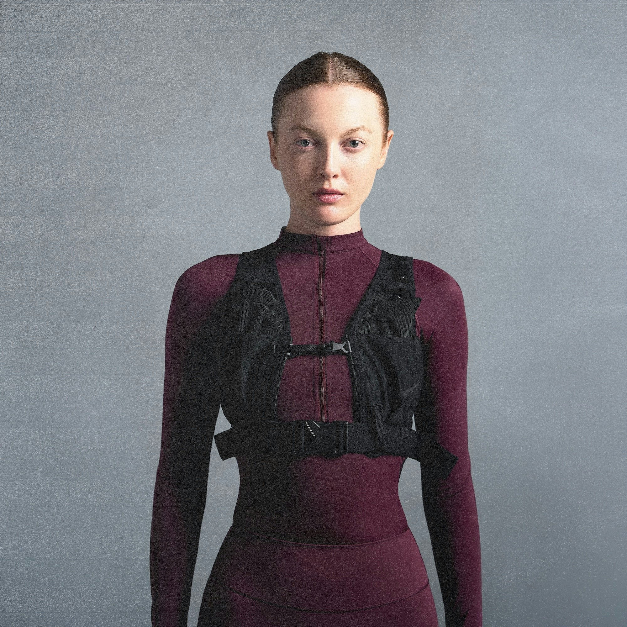 NikeSKIMS SHINE LONG SLEEVE HALF ZIP | CURRANT ON A MODEL SIDE VIEW @ | FOCUS: 0.0, 1.0, 0.9