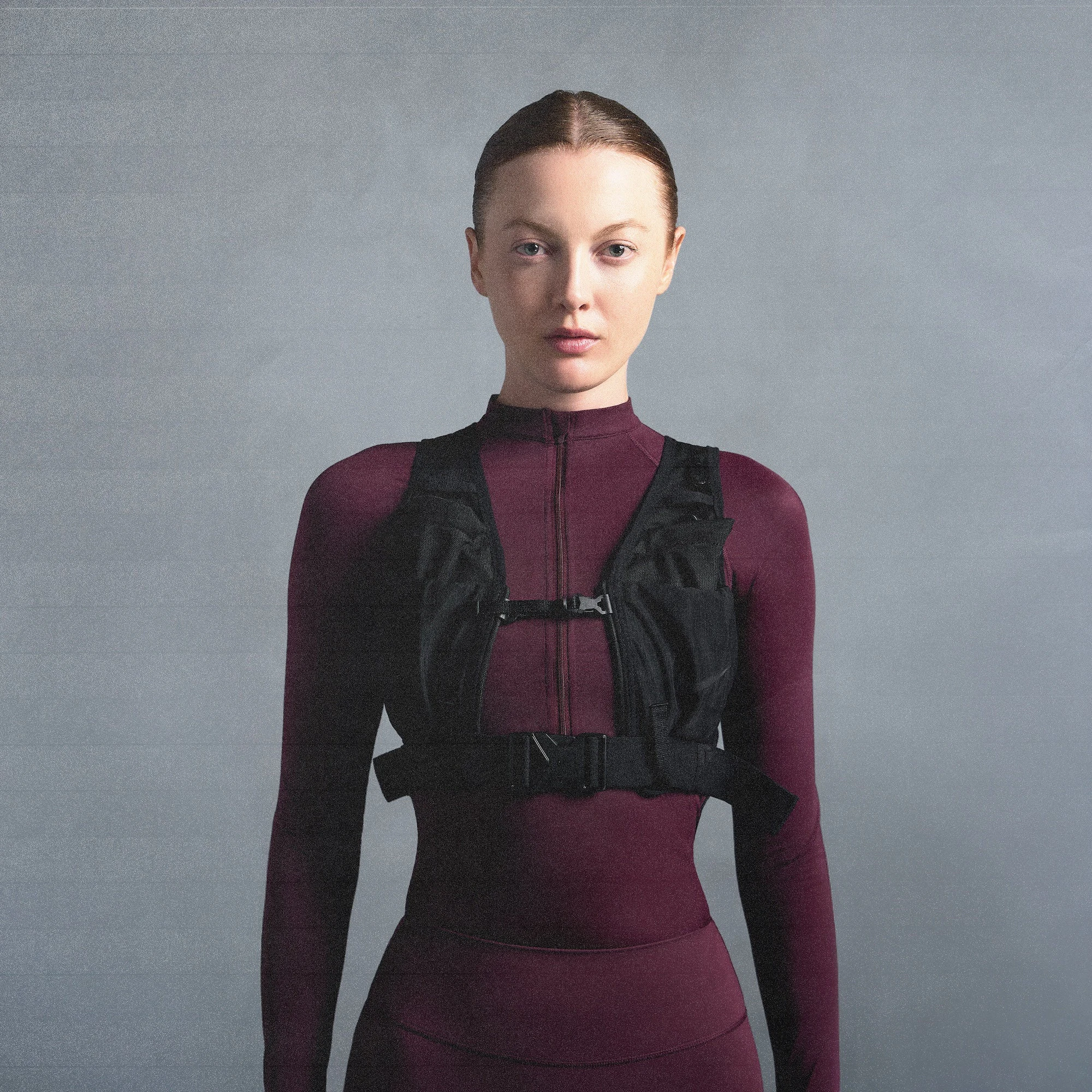 NikeSKIMS SHINE LONG SLEEVE HALF ZIP | CURRANT ON A MODEL SIDE VIEW @ | FOCUS: 0.0, 1.0, 0.9