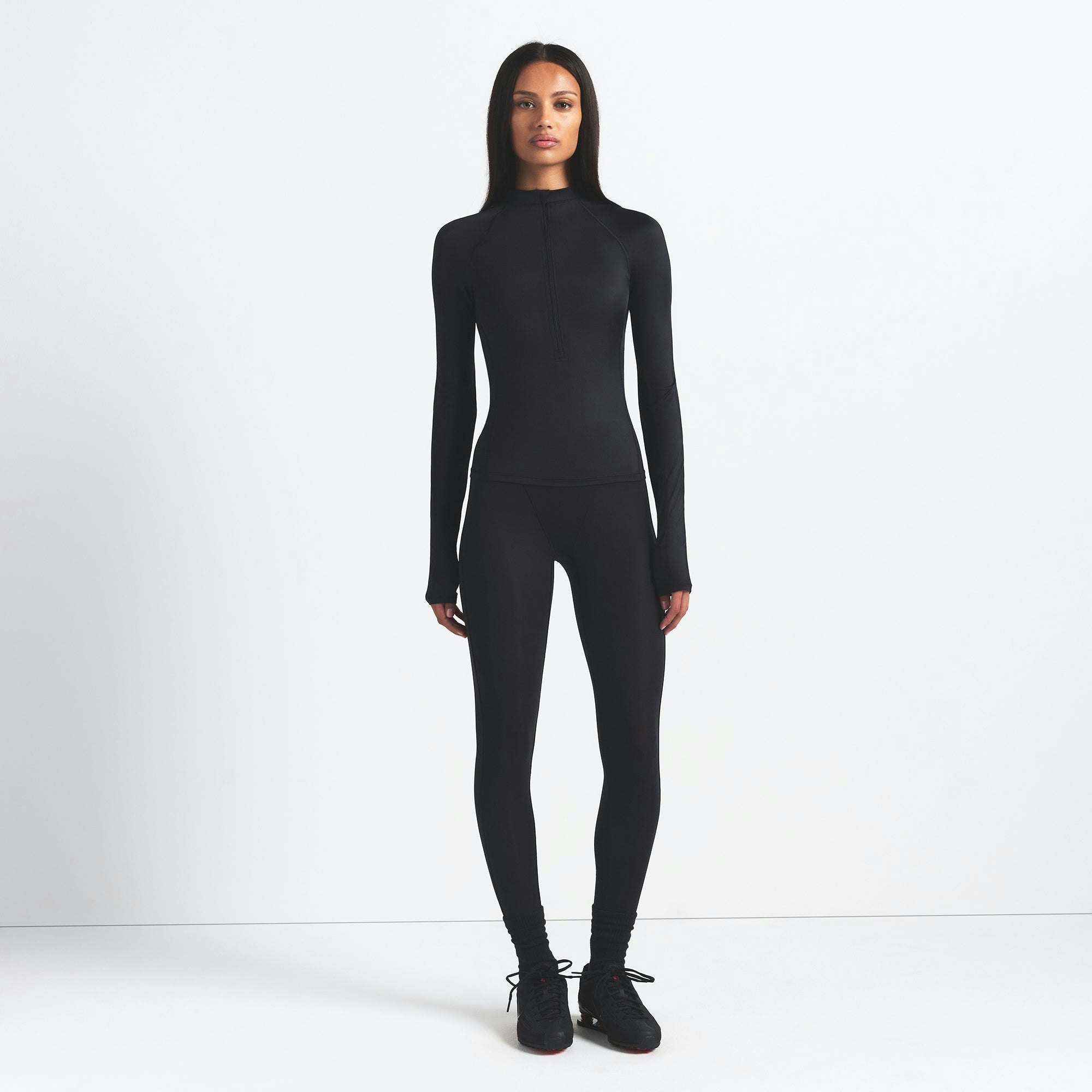 NikeSKIMS SHINE LONG SLEEVE HALF ZIP | OBSIDIAN ON A MODEL FRONT VIEW @ | FOCUS: 0.9, 0.1, 0.7