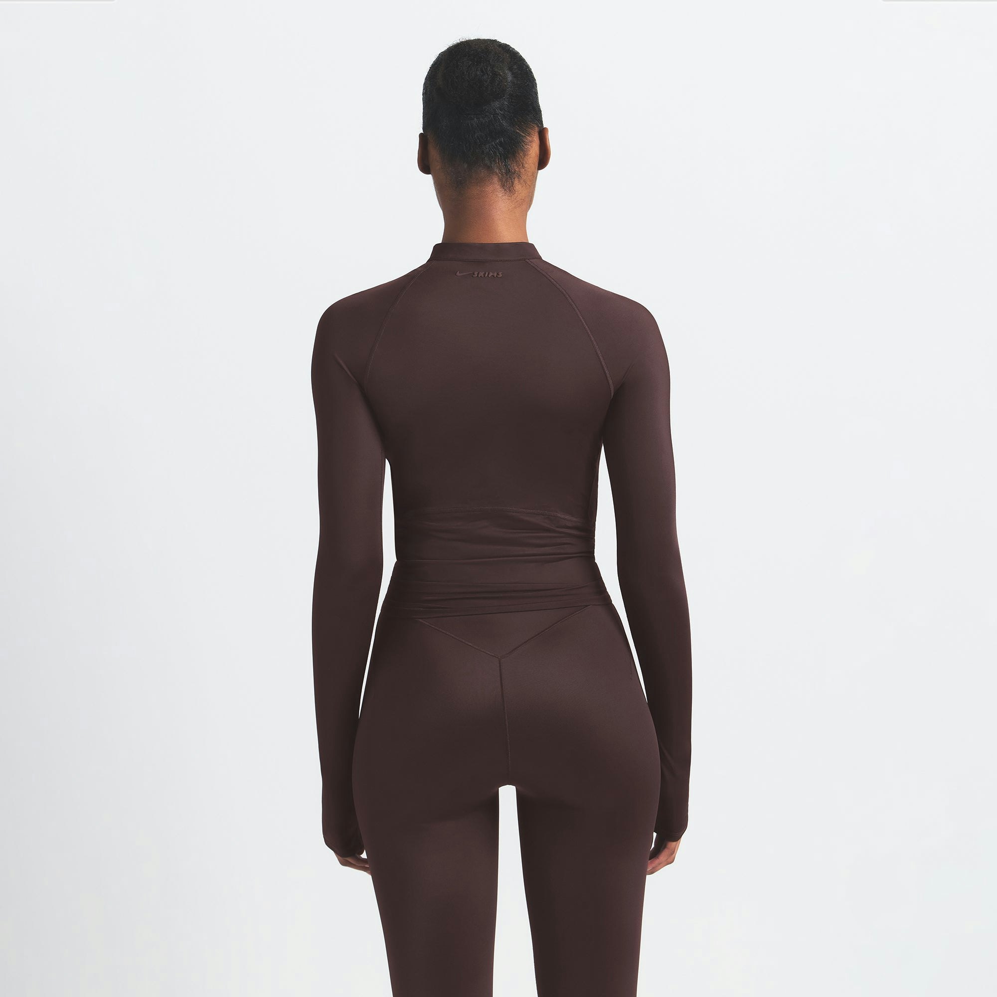 NikeSKIMS SHINE LONG SLEEVE HALF ZIP | PHOENIX ON A MODEL SIDE VIEW