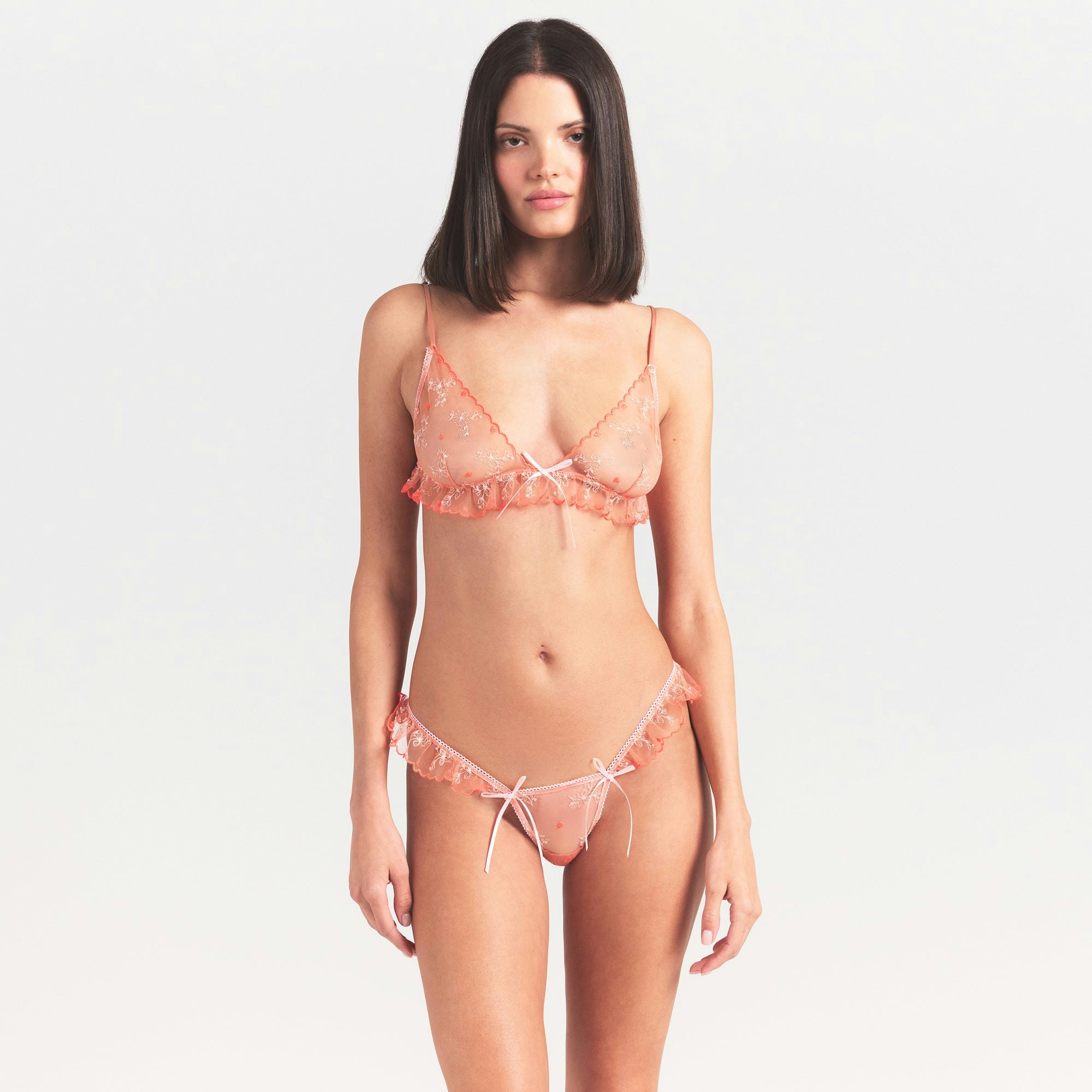 EMBROIDERED TULLE SKIMPY TRIANGLE BRALETTE | GUAVA HEART TULLE ON A MODEL SIDE VIEW @ | FOCUS: 0.0, 1.0, 0.9