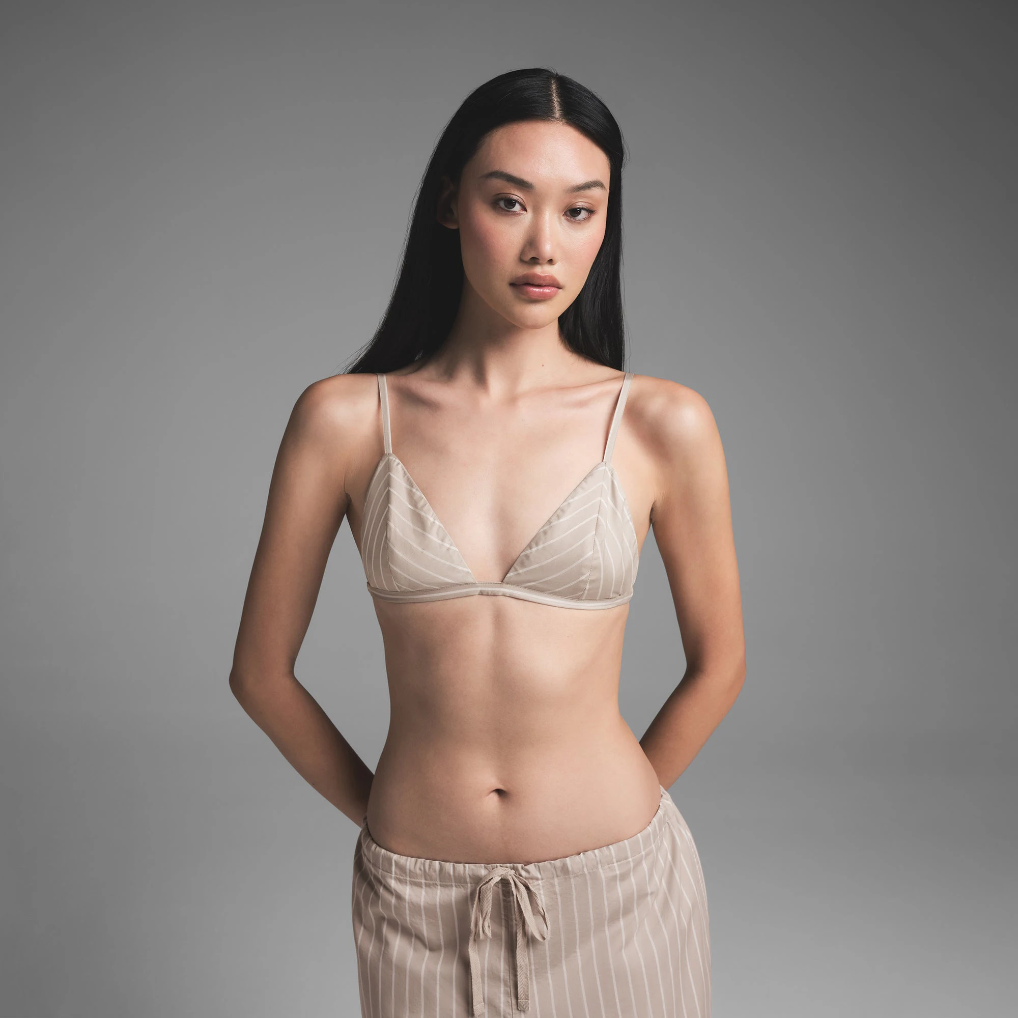 COTTON POPLIN TRIANGLE BRALETTE | STONE STRIPE ON A MODEL FRONT VIEW | FOCUS: 0.0, 1.0, 0.9