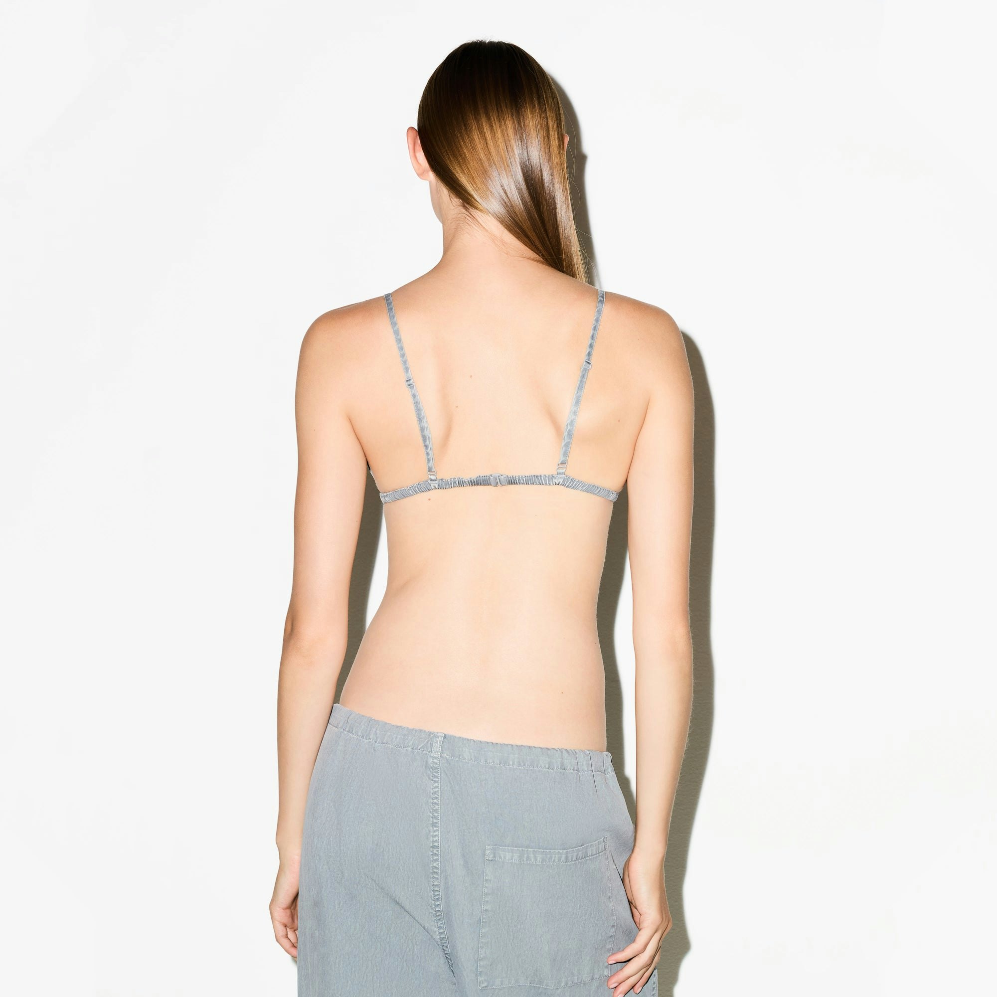 WOVEN LOUNGE TRIANGLE BRALETTE | PACIFIC ON A MODEL SIDE VIEW @ | FOCUS: 0.0, 1.0, 0.9