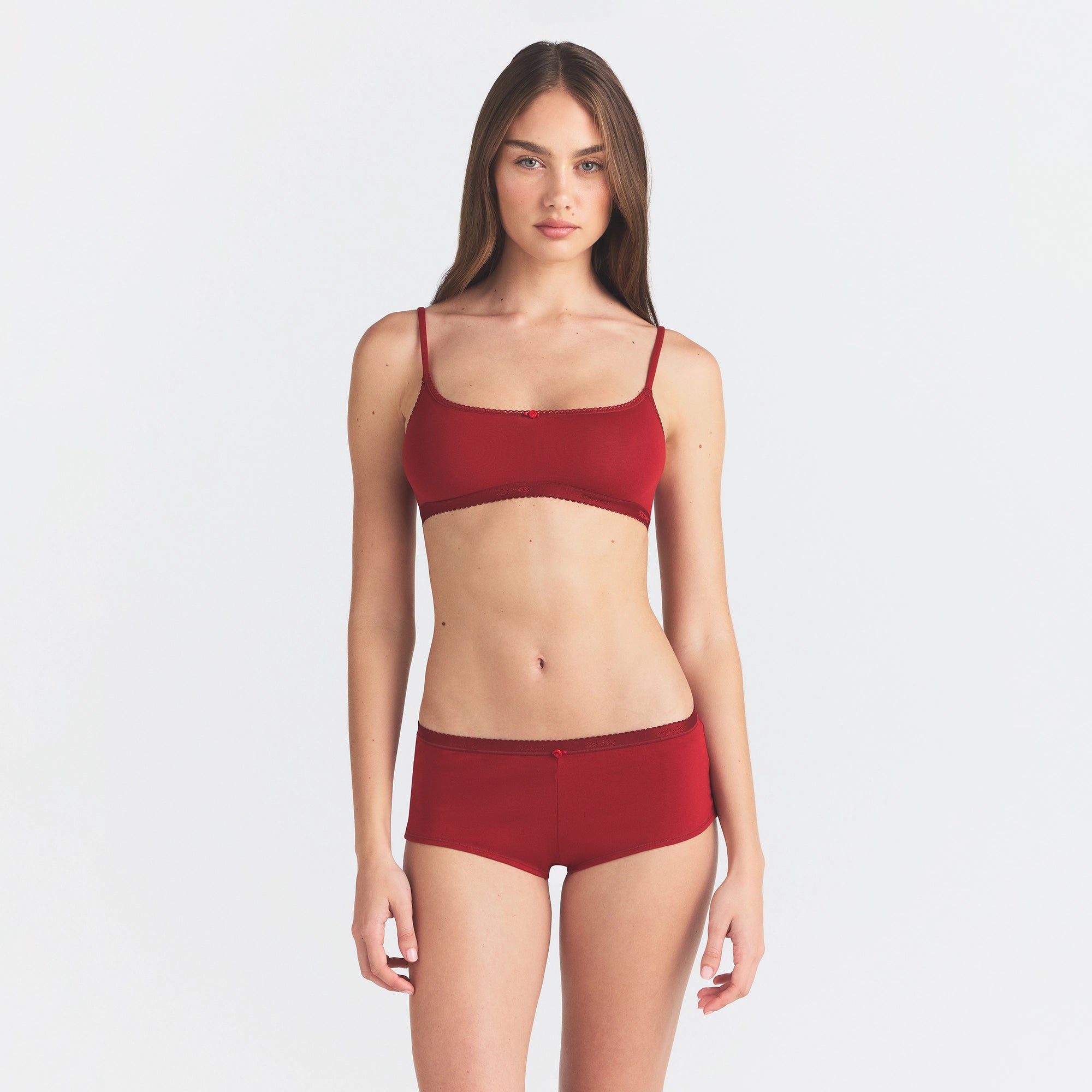 LIGHTWEIGHT COTTON LOGO PICOT BOY SHORT | BRICK TONAL ON A MODEL FRONT VIEW @ | FOCUS: 0.0, 1.0, 0.9