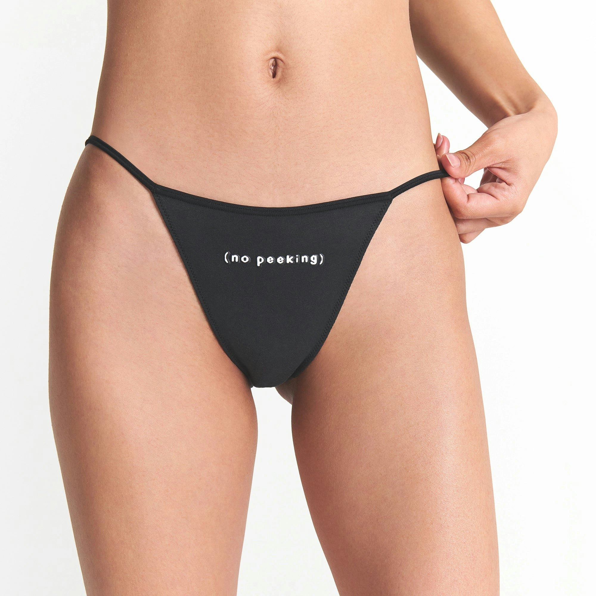 CACTUS PLANT FLEA MARKET X SKIMS COTTON JERSEY STRING BIKINI 5-PACK | SANTAS FAVORITE MULTI ON A MODEL FRONT VIEW @ | FOCUS: 0.0, 1.0, 0.9