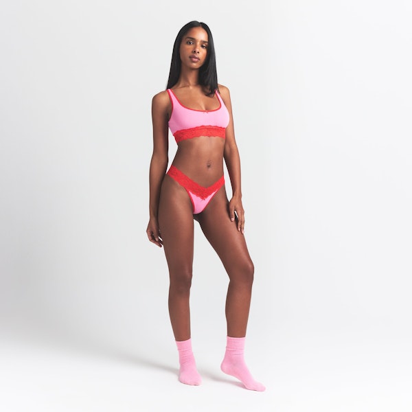 LIGHTWEIGHT COTTON LACE WIDE THONG | CARNATION CONTRAST ON A MODEL FRONT VIEW @ | FOCUS: 0.0, 1.0, 0.9